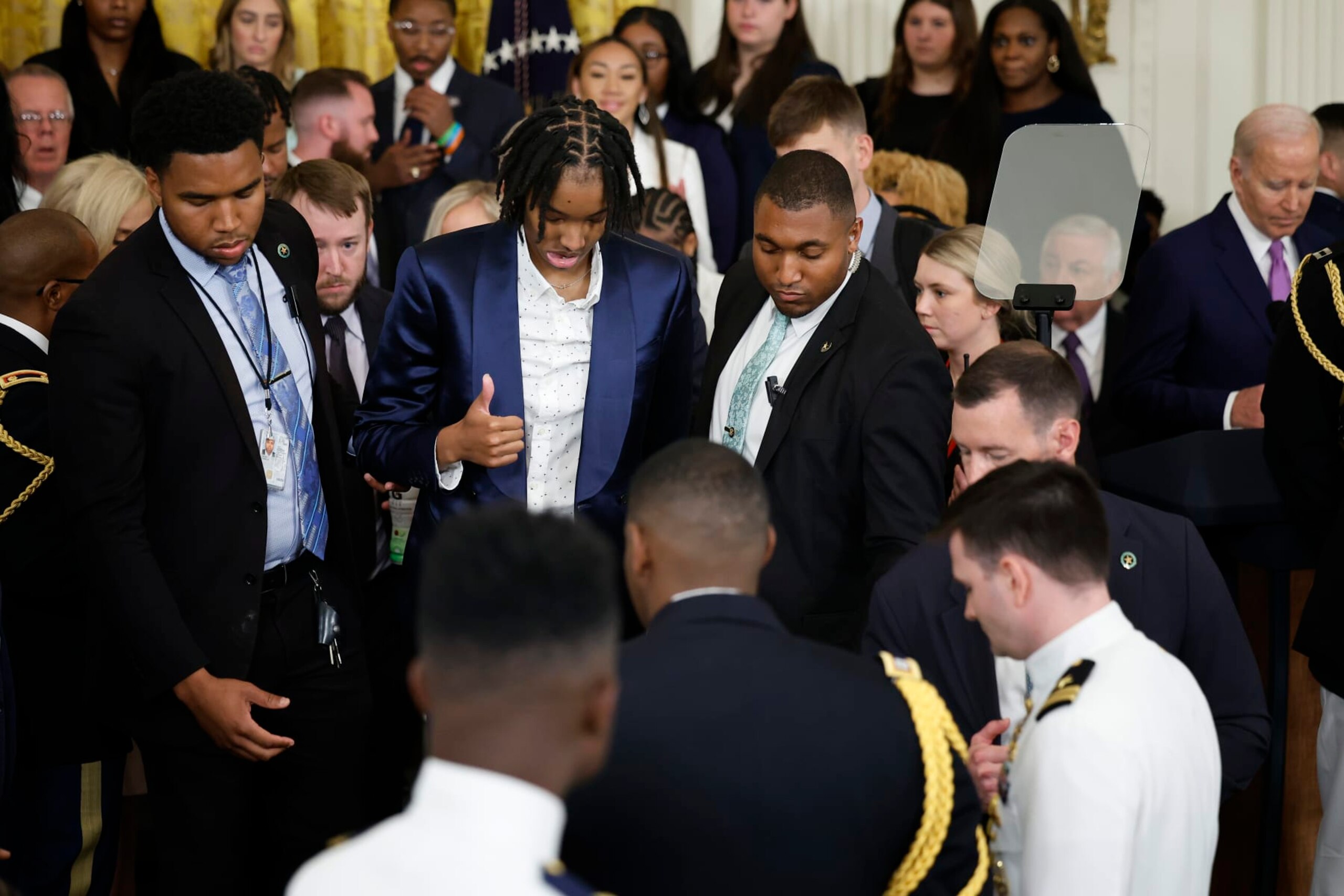 WASHINGTON, DC - MAY 26:  Louisiana State University team member Sa'Myah Smith flashes a thumbs-up after collapsing during a celebration of the team's NCAA Division I women's basketball national championship in the East Room of the White House on May 26, 2023 in Washington, DC. LSU head coach Kim Mulkey later said the Smith was fine after passing out on stage during the celebration. (Photo by Chip Somodevilla/Getty Images)