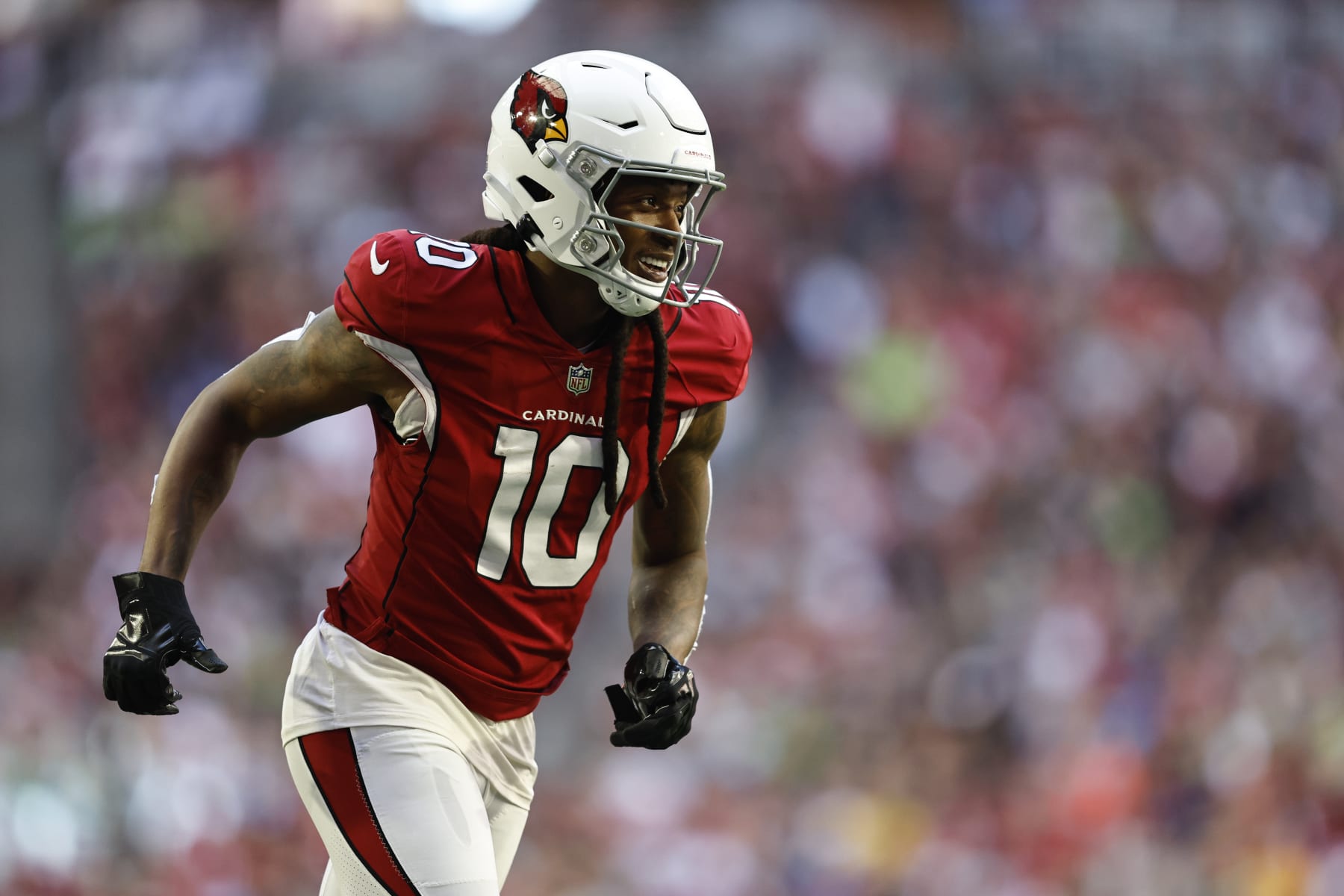 GLENDALE, ARIZONA - NOVEMBER 06: DeAndre Hopkins #10 of the Arizona Cardinals reacts as he runs during an NFL Football game between the Arizona Cardinals and the Seattle Seahawks at State Farm Stadium on November 06, 2022 in Glendale, Arizona. (Photo by Michael Owens/Getty Images)