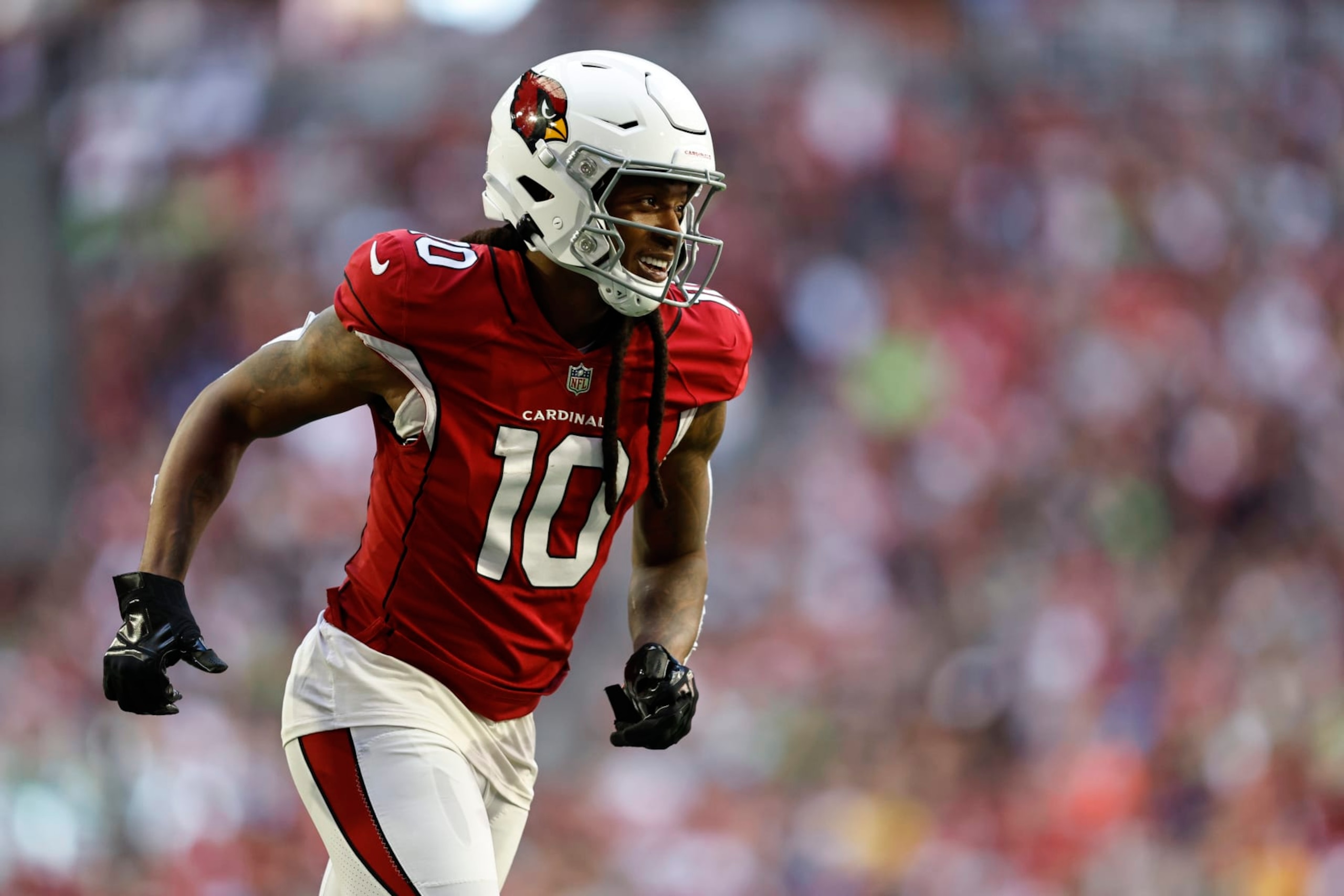 GLENDALE, ARIZONA - NOVEMBER 06: DeAndre Hopkins #10 of the Arizona Cardinals reacts as he runs during an NFL Football game between the Arizona Cardinals and the Seattle Seahawks at State Farm Stadium on November 06, 2022 in Glendale, Arizona. (Photo by Michael Owens/Getty Images)