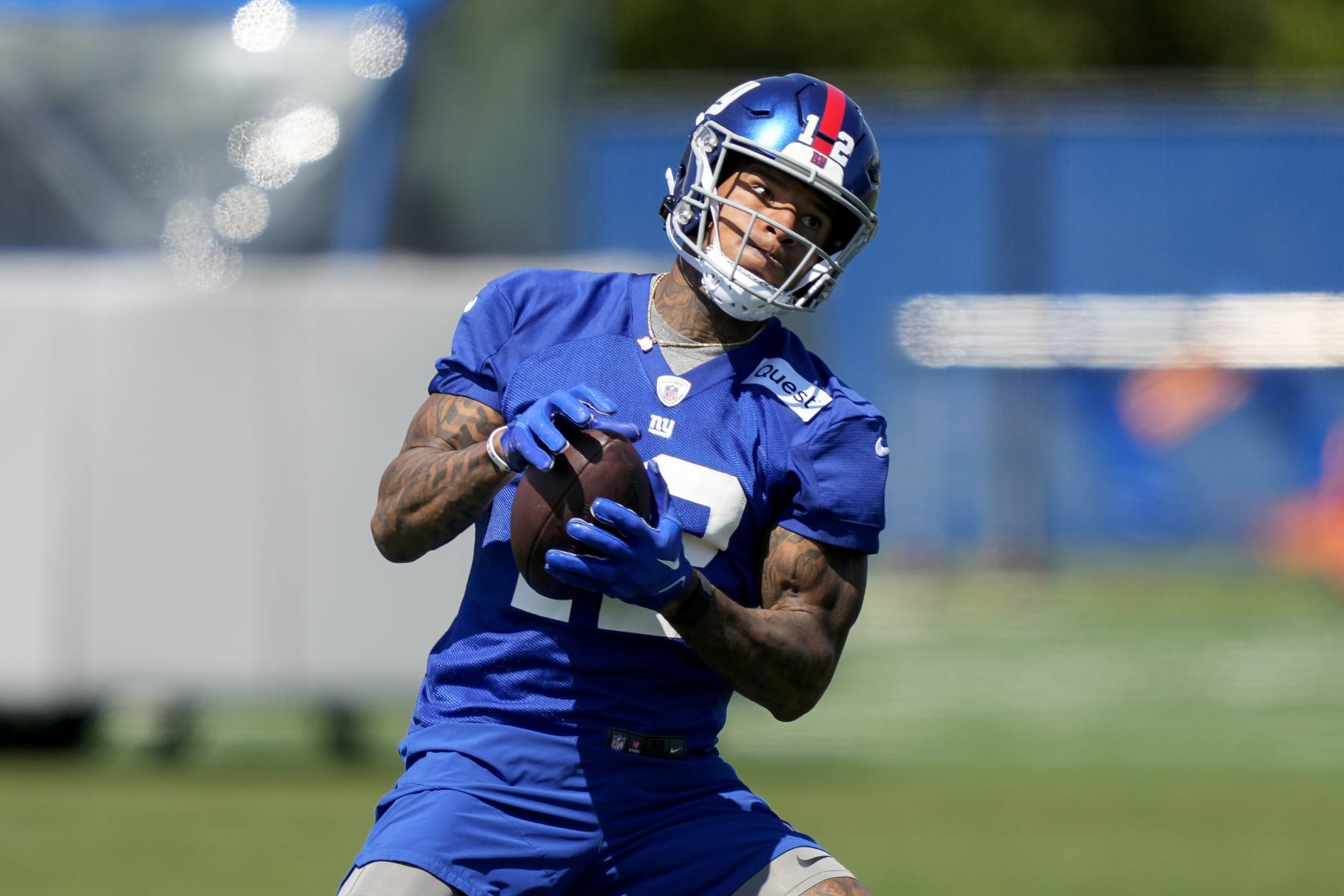 New York Giants tight end Darren Waller (12) performs a drill at the NFL football team's practice facility, Thursday, May 25, 2023, in East Rutherford, N.J. (AP Photo/John Minchillo)