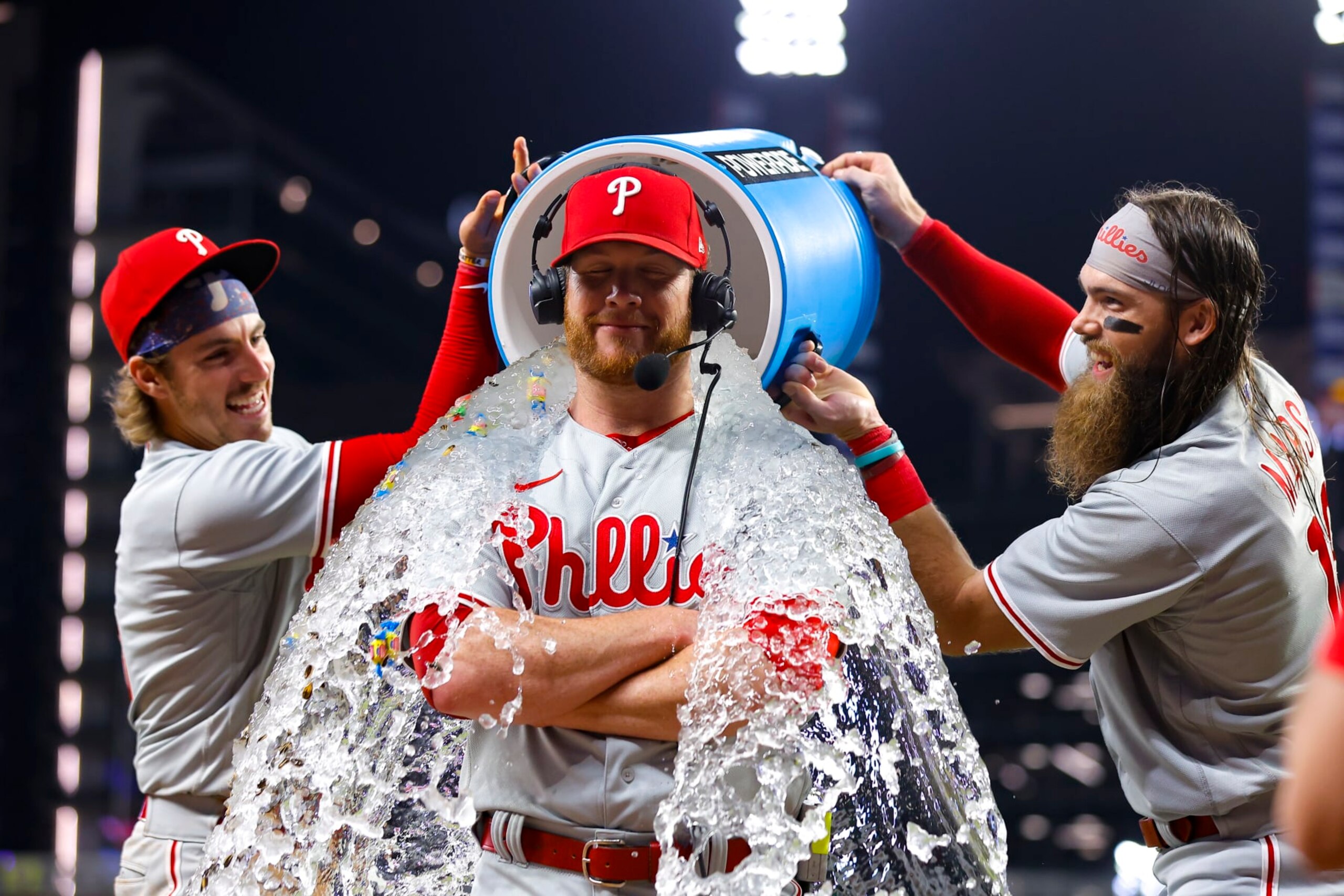 ATLANTA, GA - MAY 26: Craig Kimbrel #31 of the Philadelphia Phillies is dunked with water by Bryson Stott #5 and Brandon Marsh #16 after recording his 400th save against the Atlanta Braves at Truist Park on May 26, 2023 in Atlanta, Georgia. (Photo by Todd Kirkland/Getty Images)