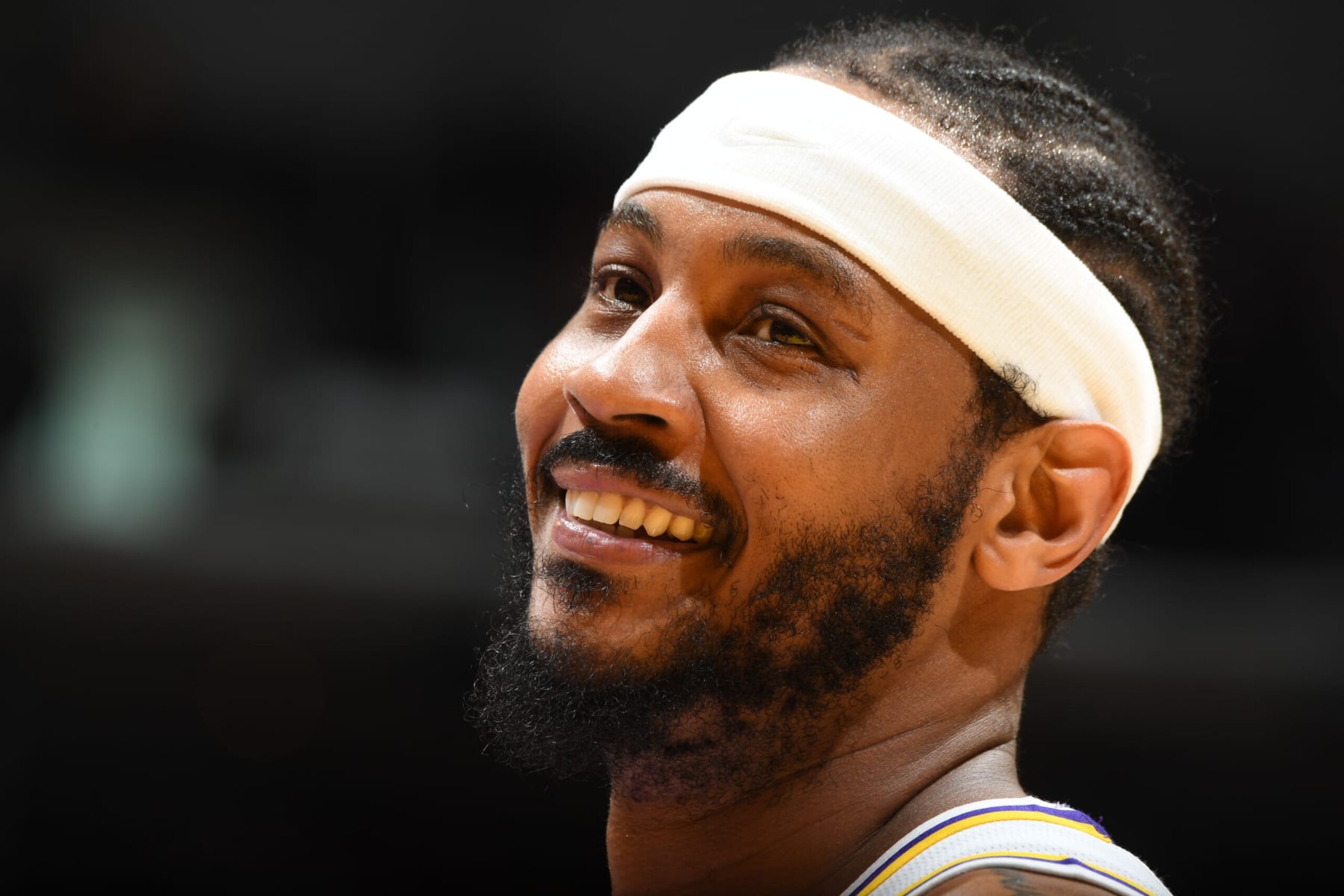 LOS ANGELES, CA - APRIL 3: Carmelo Anthony #7 of the Los Angeles Lakers smiles during the game against the Denver Nuggets on April 3, 2022 at Crypto.Com Arena in Los Angeles, California. NOTE TO USER: User expressly acknowledges and agrees that, by downloading and/or using this Photograph, user is consenting to the terms and conditions of the Getty Images License Agreement. Mandatory Copyright Notice: Copyright 2022 NBAE (Photo by Andrew D. Bernstein/NBAE via Getty Images)