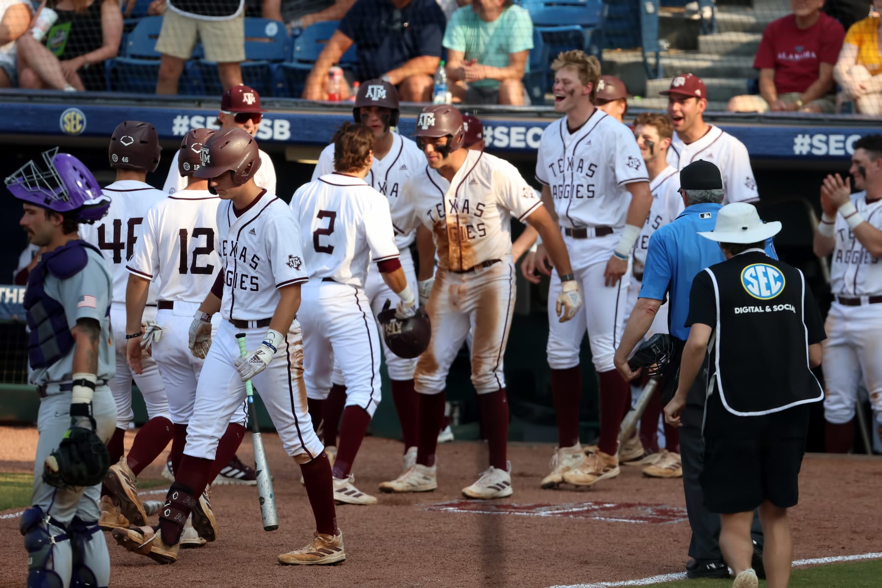 HOOVER, AL - MAY 26: Texas A&M Aggies players congratulate Texas A&M Aggies infielder Hunter Haas (2) during the 2023 SEC Baseball Tournament game between the LSU Tigers and the Texas A&M Aggies on May 26, 2023 at Hoover Metropolitan Stadium in Hoover, Alabama.  (Photo by Michael Wade/Icon Sportswire via Getty Images)