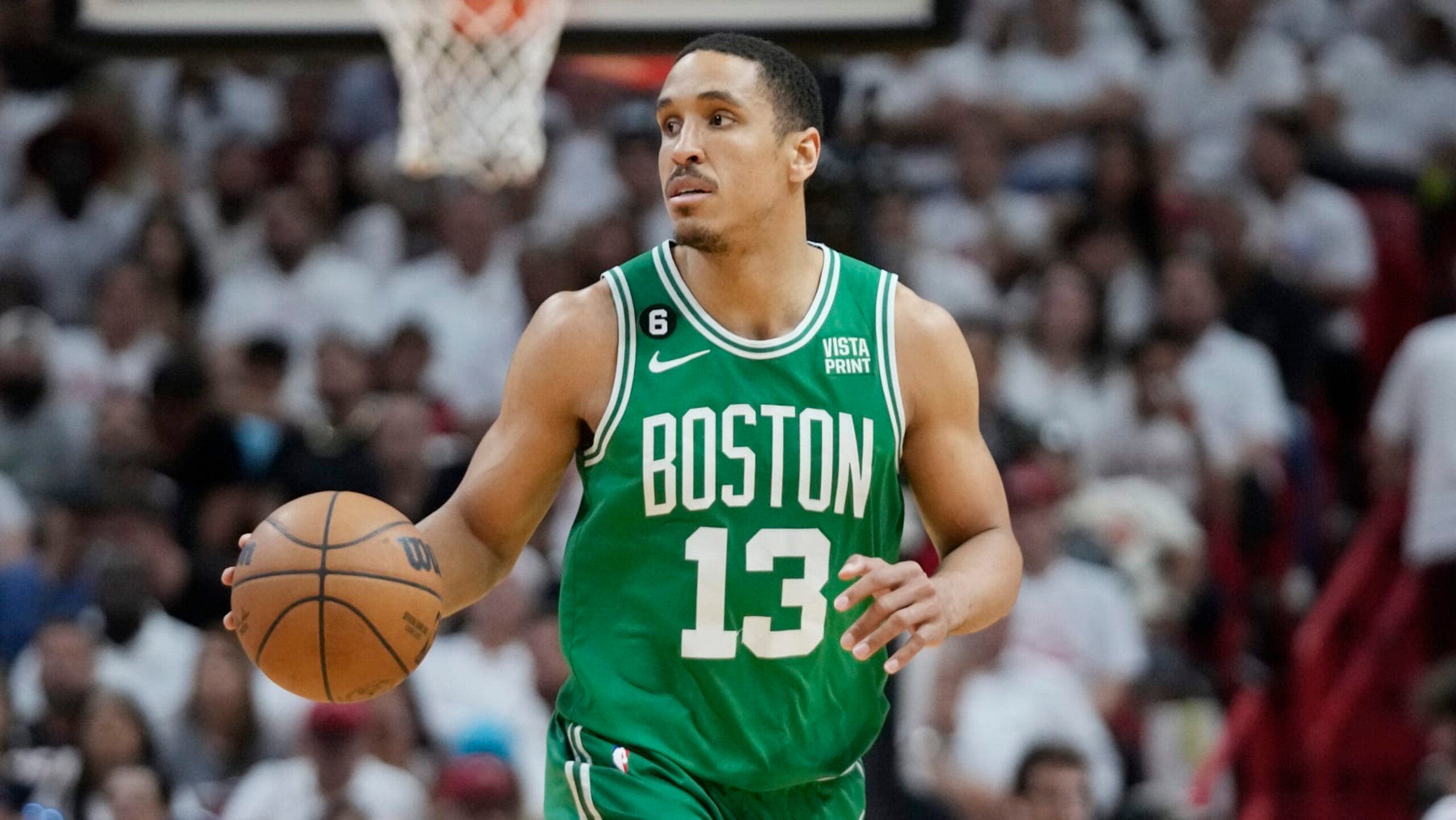 Boston Celtics guard Malcolm Brogdon (13) dribbles the ball during Game 4 of the NBA basketball playoffs Eastern Conference finals against the Miami Heat, Tuesday, May 23, 2023, in Miami. (AP Photo/Wilfredo Lee) Boston Celtics guard Malcolm Brogdon (13) dribbles the ball during Game 4 of the NBA basketball playoffs Eastern Conference finals against the Miami Heat, Tuesday, May 23, 2023, in Miami. (AP Photo/Wilfredo Lee)