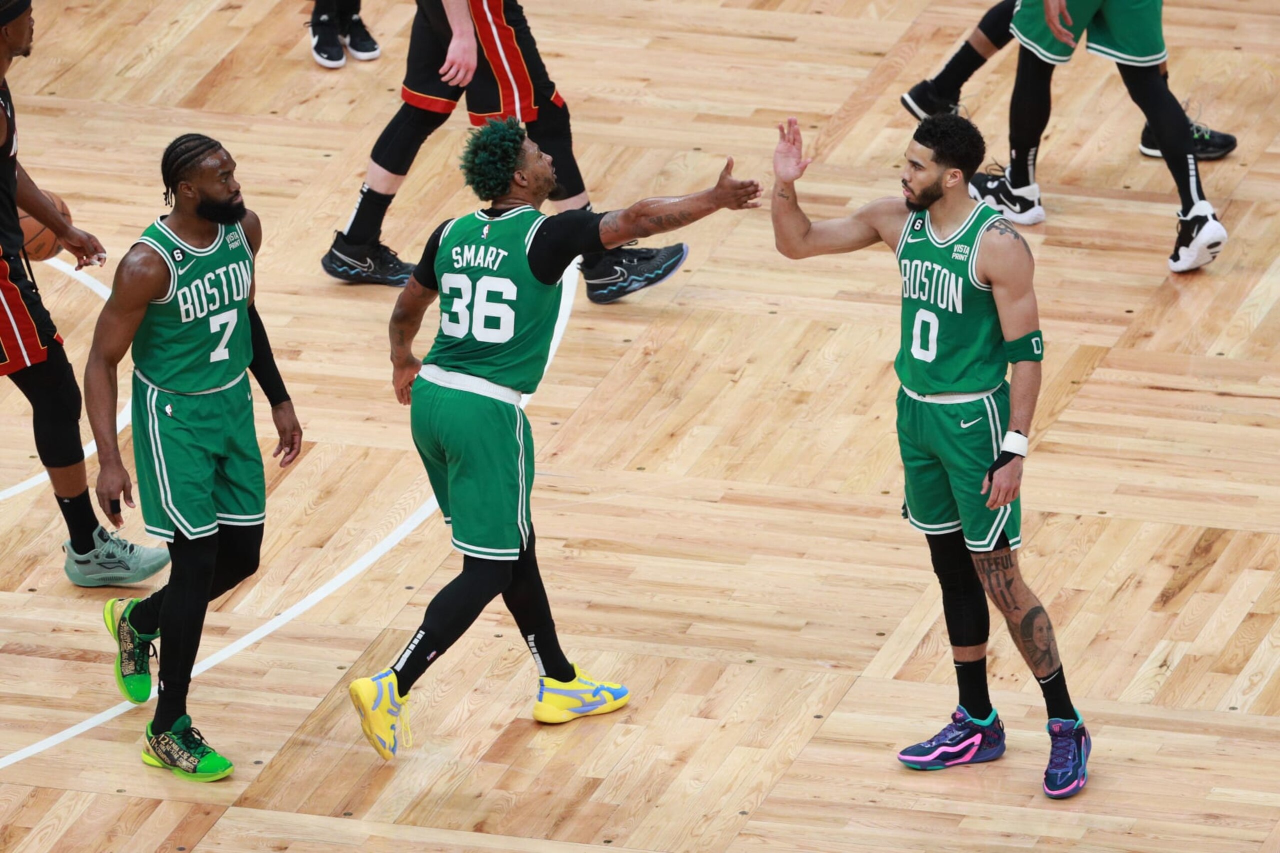 BOSTON, MA - MAY 25: Marcus Smart #36 and Jayson Tatum #0 of the Boston Celtics high five during the game against the Miami Heat during the Eastern Conference Finals of the 2023 NBA Playoffs on May 25, 2023 at the TD Garden in Boston, Massachusetts. NOTE TO USER: User expressly acknowledges and agrees that, by downloading and or using this photograph, User is consenting to the terms and conditions of the Getty Images License Agreement. Mandatory Copyright Notice: Copyright 2023 NBAE  (Photo by Chris Marion/NBAE via Getty Images)