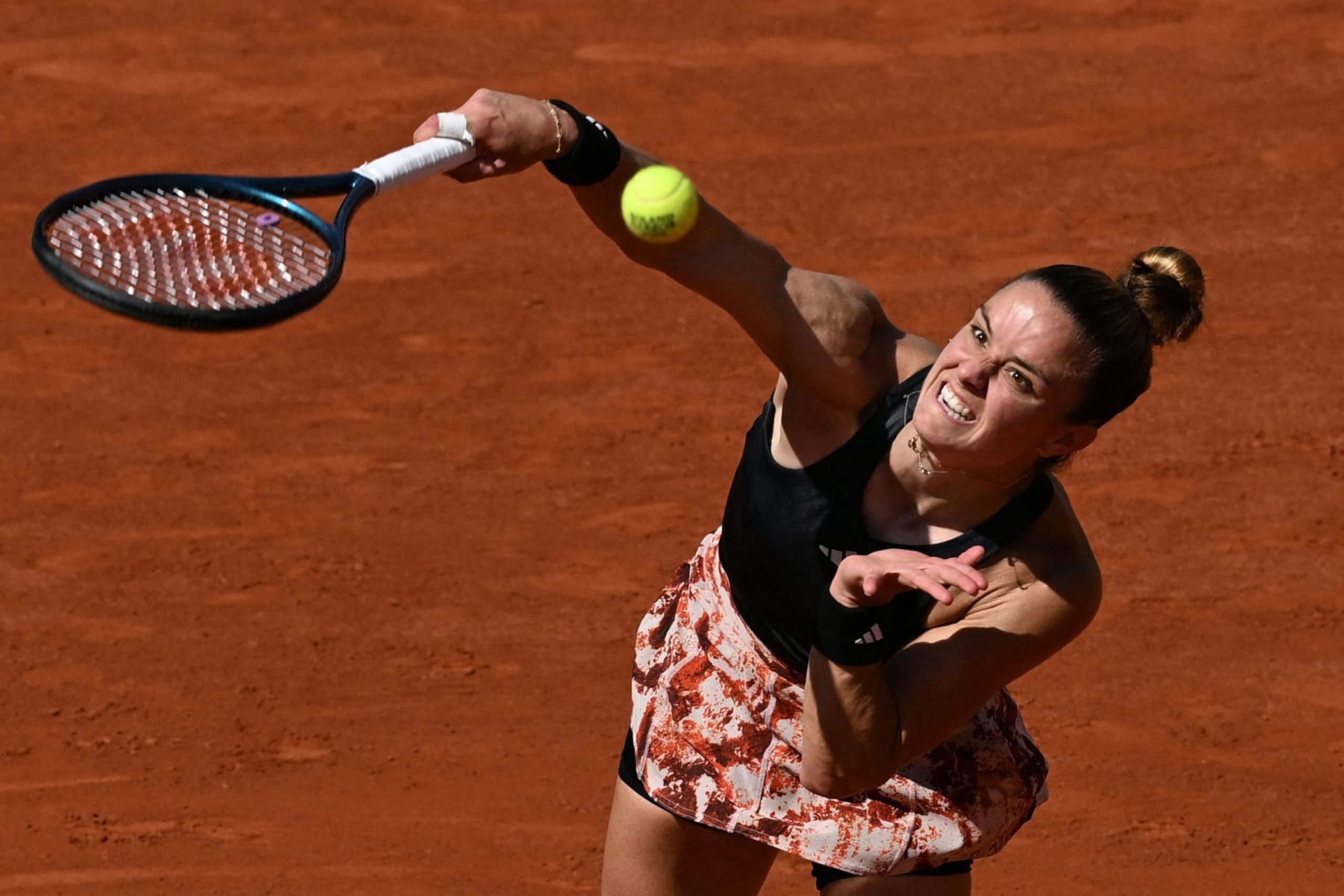 Greece's Maria Sakkari serves to Czech Republic's Karolina Muchova during their women's singles match on day one of the Roland-Garros Open tennis tournament at the Court Suzanne-Lenglen in Paris on May 28, 2023. (Photo by Emmanuel DUNAND / AFP) (Photo by EMMANUEL DUNAND/AFP via Getty Images)