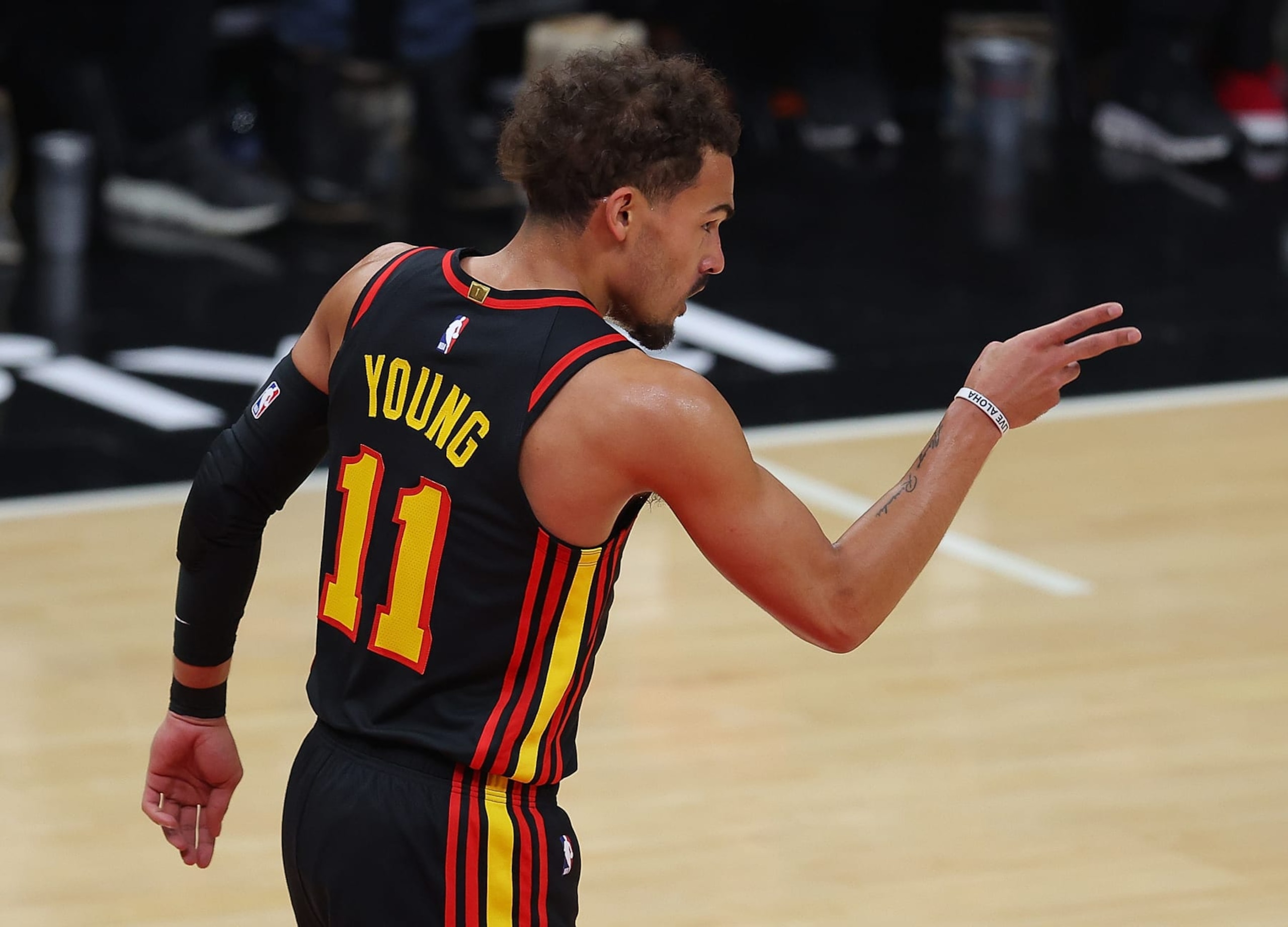 ATLANTA, GEORGIA - APRIL 27:  Trae Young #11 of the Atlanta Hawks reacts after drawing a foul after a basket against the Boston Celtics during the first quarter of Game Six of the Eastern Conference First Round Playoffs at State Farm Arena on April 27, 2023 in Atlanta, Georgia.  NOTE TO USER: User expressly acknowledges and agrees that, by downloading and or using this photograph, User is consenting to the terms and conditions of the Getty Images License Agreement.  (Photo by Kevin C. Cox/Getty Images)