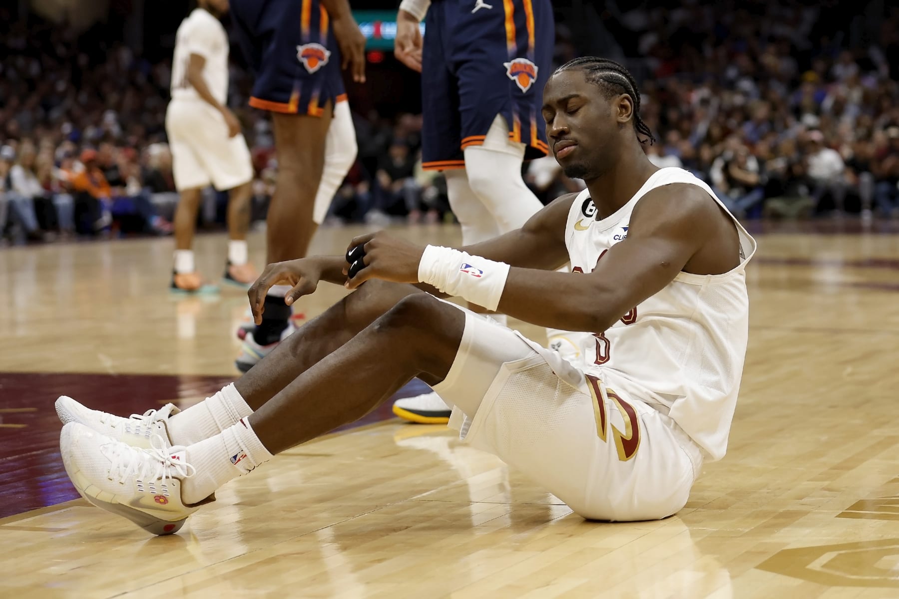 CLEVELAND, OH - APRIL 26:  Caris LeVert #3 of the Cleveland Cavaliers sits on the court after being called for a foul during Game Five of the Eastern Conference First Round Playoffs against the New York Knicks at Rocket Mortgage Fieldhouse on April 26, 2023 in Cleveland, Ohio. New York defeated Cleveland 106-95 to win the series 4-1. NOTE TO USER: User expressly acknowledges and agrees that, by downloading and or using this photograph, User is consenting to the terms and conditions of the Getty Images License Agreement. (Photo by Kirk Irwin/Getty Images)