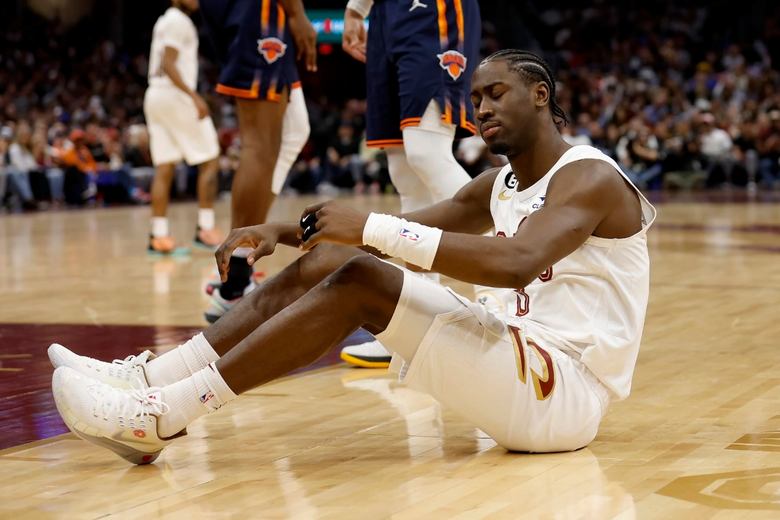 CLEVELAND, OH - APRIL 26:  Caris LeVert #3 of the Cleveland Cavaliers sits on the court after being called for a foul during Game Five of the Eastern Conference First Round Playoffs against the New York Knicks at Rocket Mortgage Fieldhouse on April 26, 2023 in Cleveland, Ohio. New York defeated Cleveland 106-95 to win the series 4-1. NOTE TO USER: User expressly acknowledges and agrees that, by downloading and or using this photograph, User is consenting to the terms and conditions of the Getty Images License Agreement. (Photo by Kirk Irwin/Getty Images)