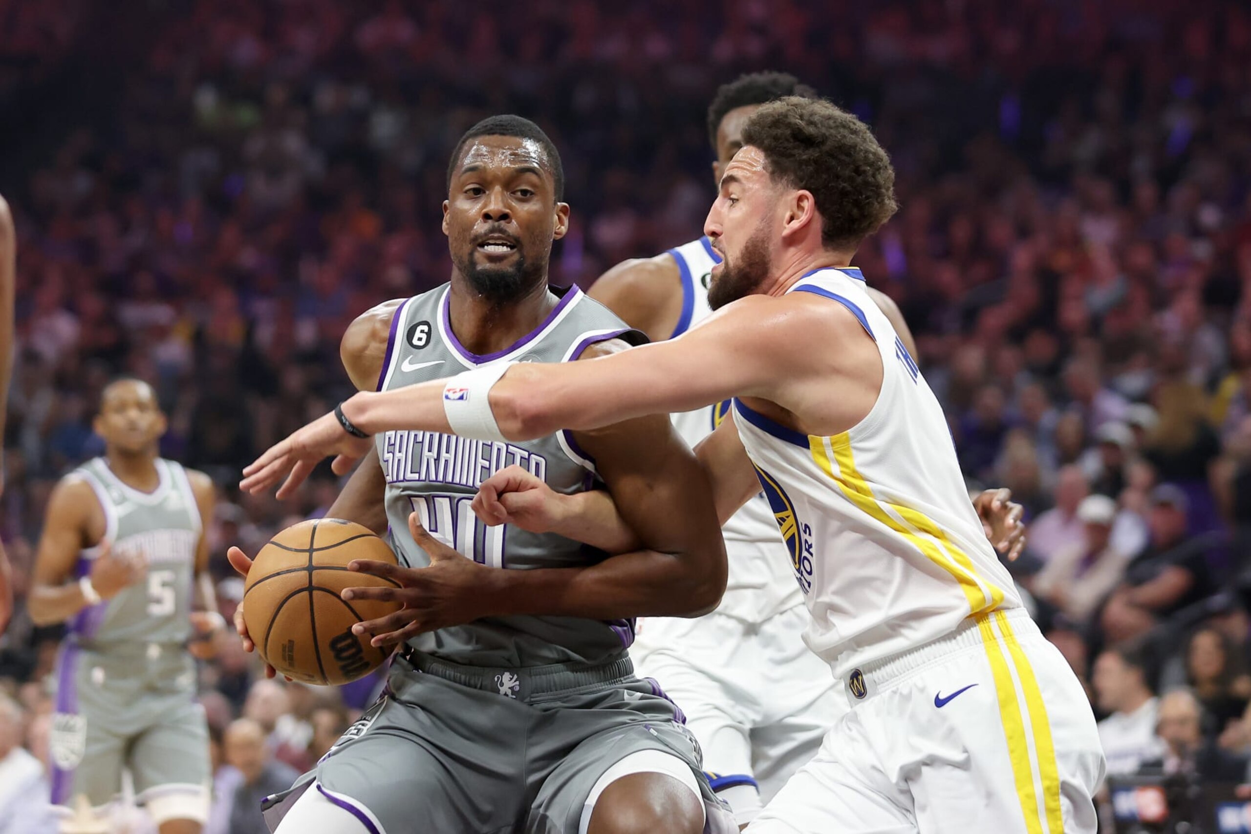 SACRAMENTO, CALIFORNIA - APRIL 26: Harrison Barnes #40 of the Sacramento Kings is guarded by Klay Thompson #11 of the Golden State Warriors in the first half of Game Five of the Western Conference First Round Playoffs at Golden 1 Center on April 26, 2023 in Sacramento, California. NOTE TO USER: User expressly acknowledges and agrees that, by downloading and or using this photograph, User is consenting to the terms and conditions of the Getty Images License Agreement. (Photo by Ezra Shaw/Getty Images)