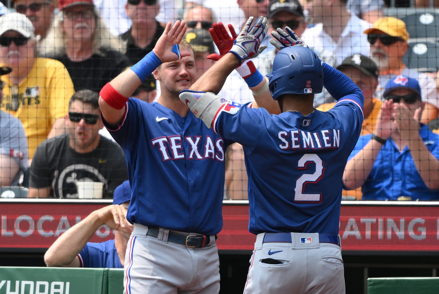 PITTSBURGH, PENNSYLVANIA - MAY 24: Marcus Semien #2 of the Texas Rangers is met at the dugout by Josh Jung #6 after hitting a solo home run in the first inning during the game against the Pittsburgh Pirates at PNC Park on May 24, 2023 in Pittsburgh, Pennsylvania. (Photo by Justin Berl/Getty Images)