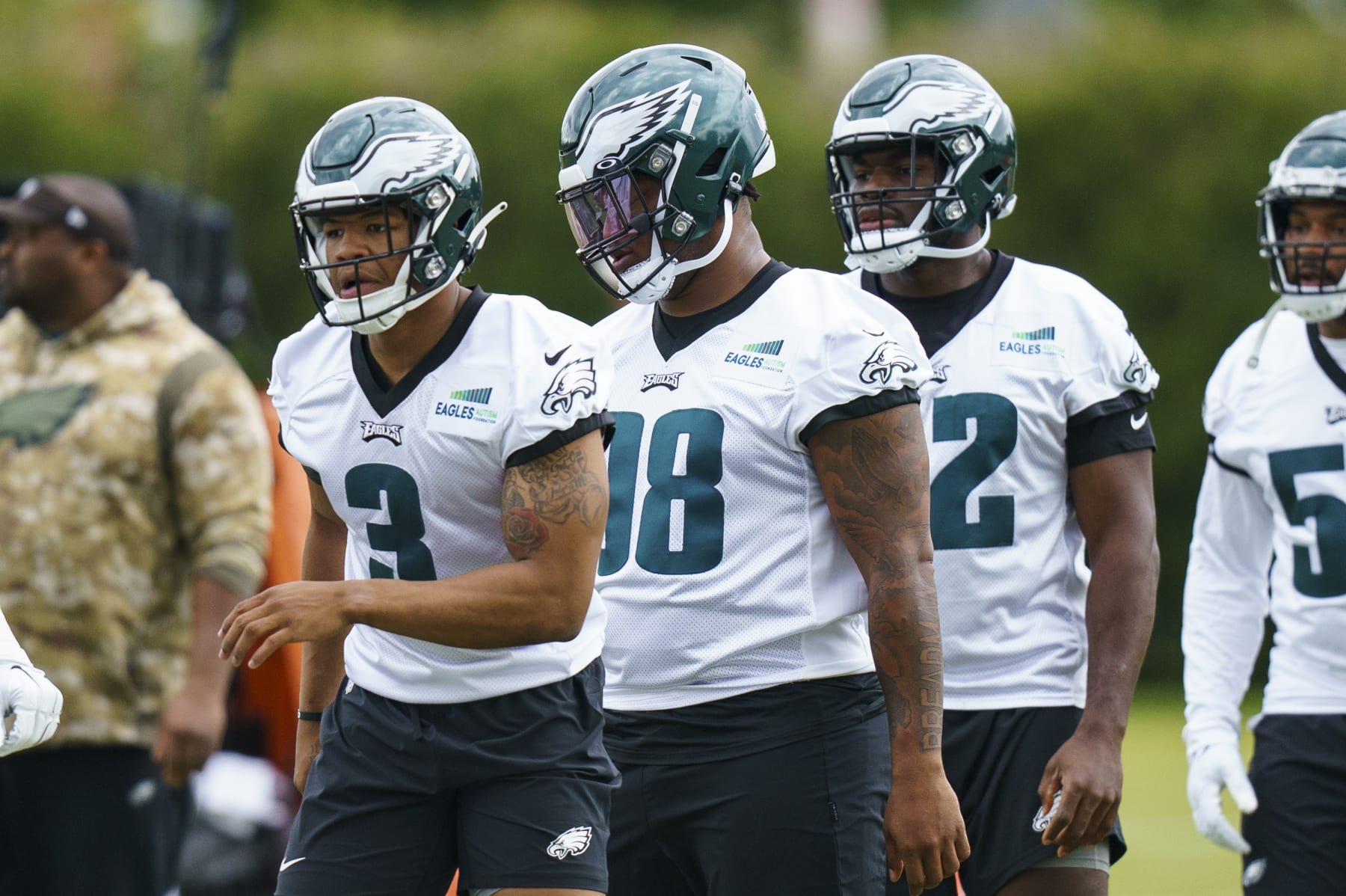 Philadelphia Eagles' Nolan Smith, left, and Jalen Carter, center, looks on during NFL rookie football minicamp, Friday, May 5, 2023, in Philadelphia. (AP Photo/Chris Szagola)