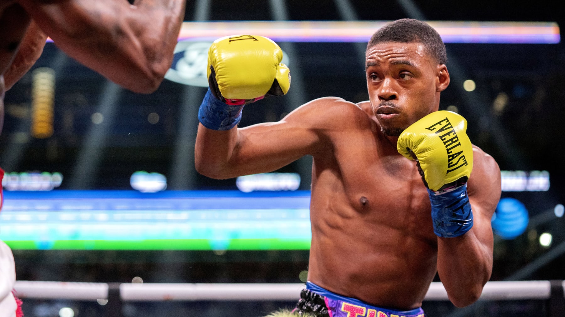 Errol Spence Jr. throws a punch at Yordenis Ugas, from Cuba, during a unified world welterweight championship boxing match Saturday, April 16, 2022, in Arlington, Texas. Spence Jr. won by technical knockout in 10 rounds. (AP Photo/Jeffrey McWhorter)