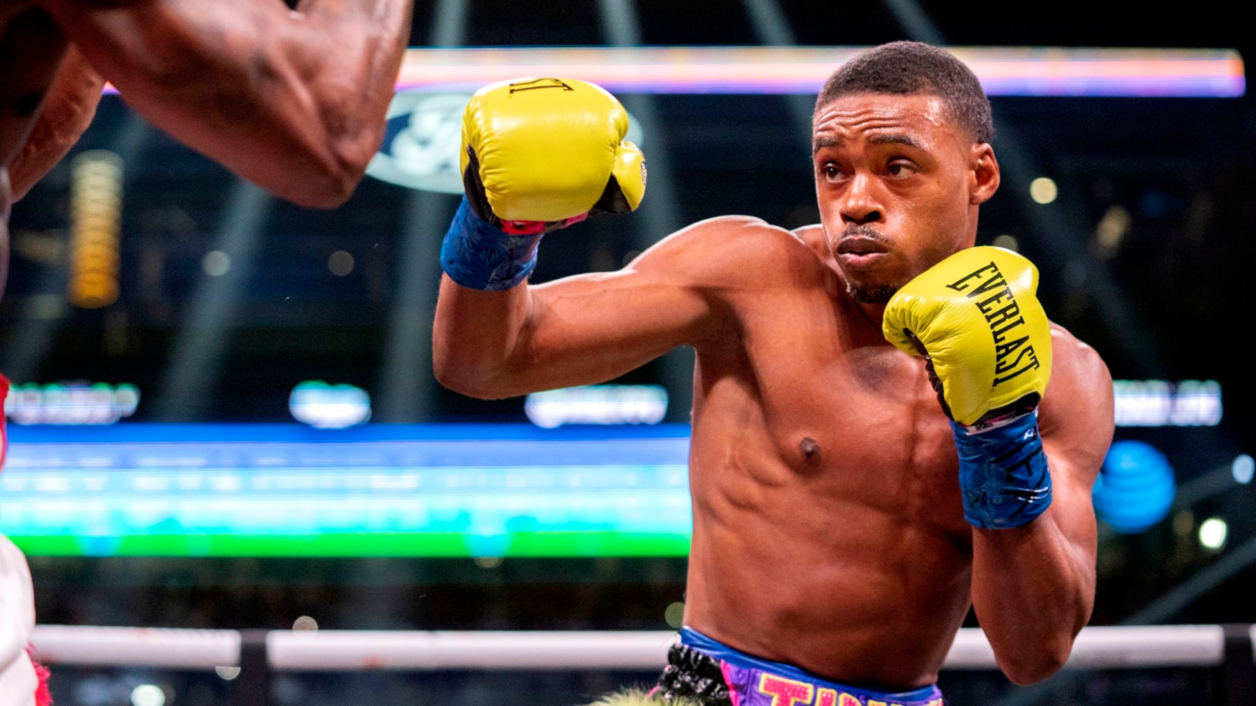 Errol Spence Jr. throws a punch at Yordenis Ugas, from Cuba, during a unified world welterweight championship boxing match Saturday, April 16, 2022, in Arlington, Texas. Spence Jr. won by technical knockout in 10 rounds. (AP Photo/Jeffrey McWhorter)