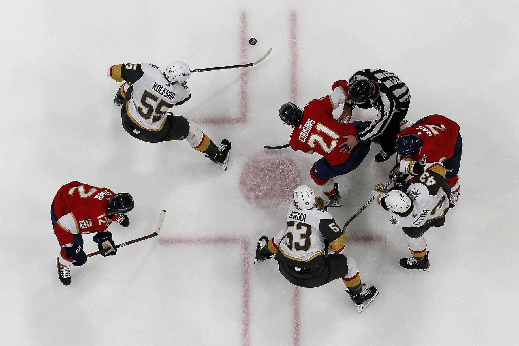 SUNRISE, FLORIDA - MARCH 7: Keegan Kolesar #55 of the Vegas Golden Knights gathers the puck after a face off against Nick Cousins #21 of the Florida Panthers at the FLA Live Arena on March 7, 2023 in Sunrise, Florida. (Photo by Eliot J. Schechter/NHLI via Getty Images)