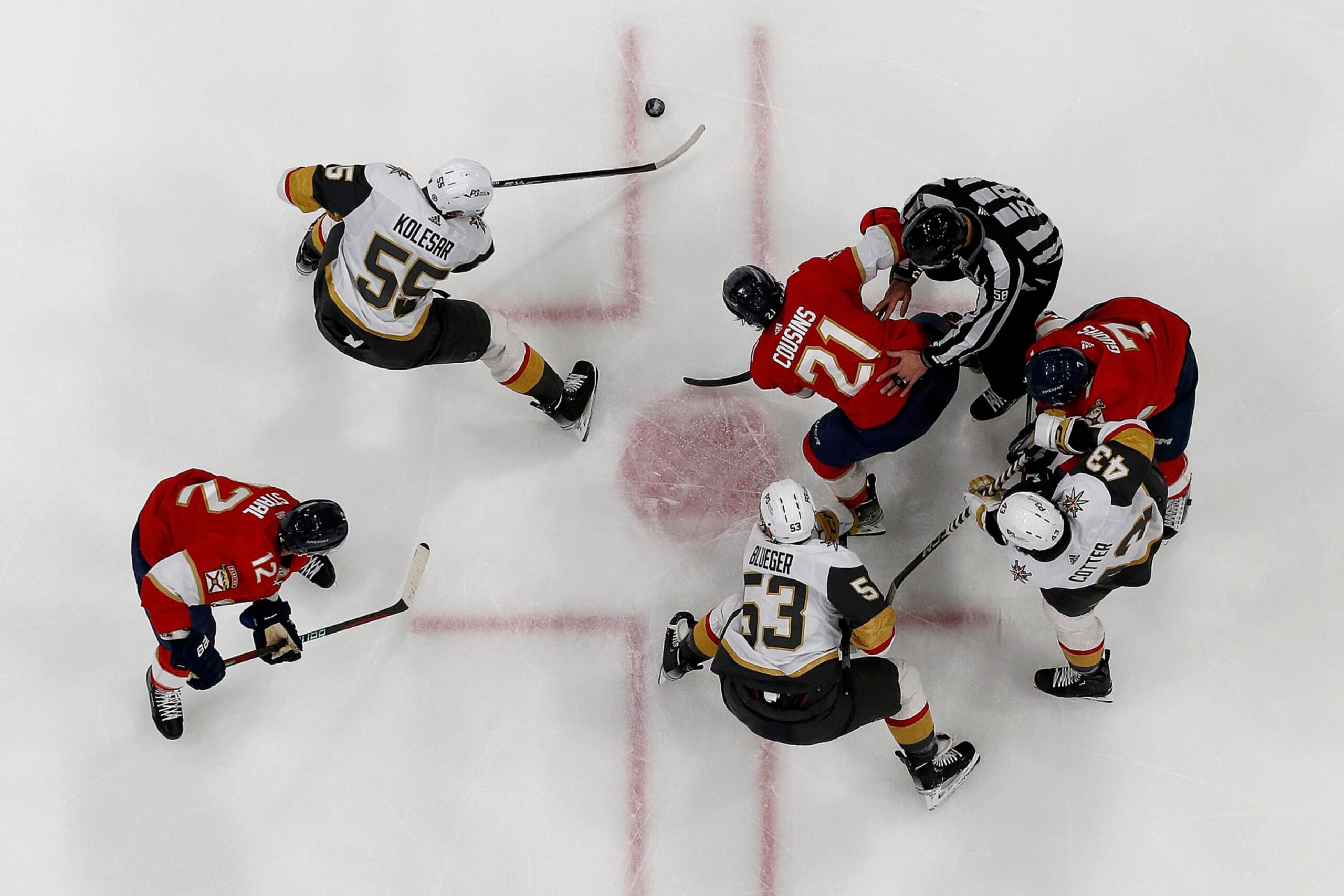 SUNRISE, FLORIDA - MARCH 7: Keegan Kolesar #55 of the Vegas Golden Knights gathers the puck after a face off against Nick Cousins #21 of the Florida Panthers at the FLA Live Arena on March 7, 2023 in Sunrise, Florida. (Photo by Eliot J. Schechter/NHLI via Getty Images)