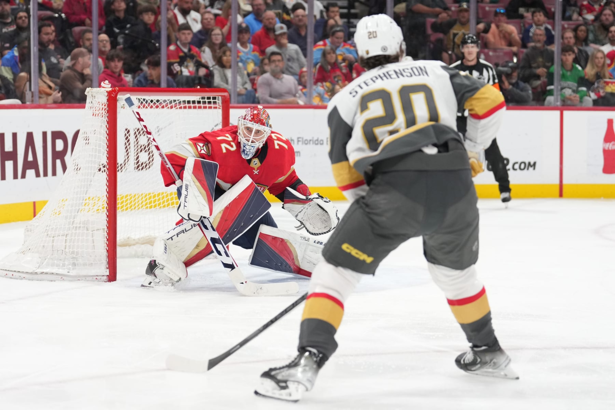 SUNRISE, FL - MARCH 07: \fla72\ eyes Vegas Golden Knights center Chandler Stephenson (20) as he attacks with the puck during the game between the Vegas Golden Knights and the Florida Panthers on Tuesday, March 7, 2023 at FLA Live Arena in Sunrise, Fla. (Photo by Peter Joneleit/Icon Sportswire via Getty Images)