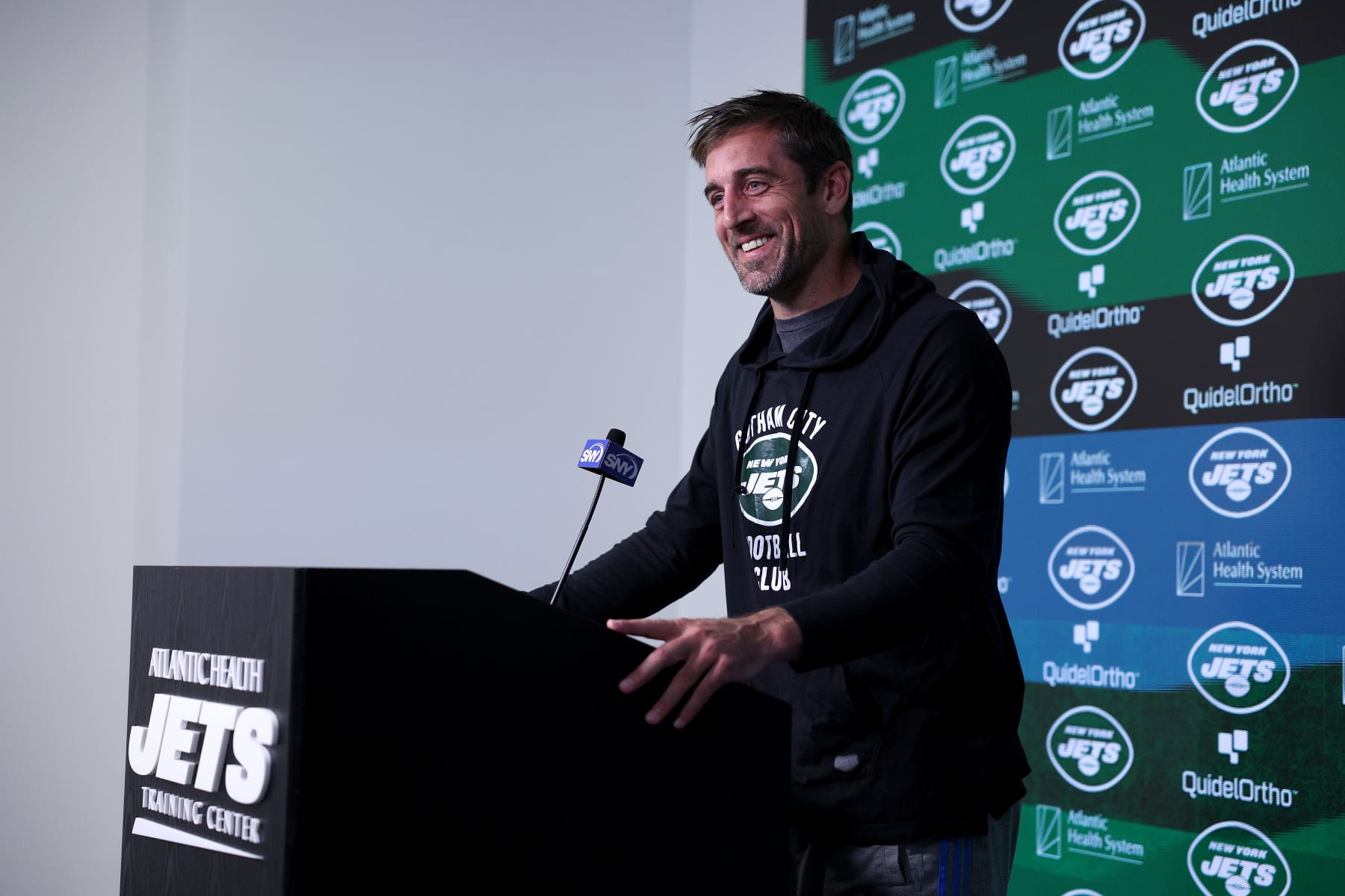 FLORHAM PARK, NEW JERSEY - MAY 23: Aaron Rodgers #8 of the New York Jets answers questions after an offseason workout session at Atlantic Health Jets Training Center on May 23, 2023 in Florham Park, New Jersey. (Photo by Elsa/Getty Images)