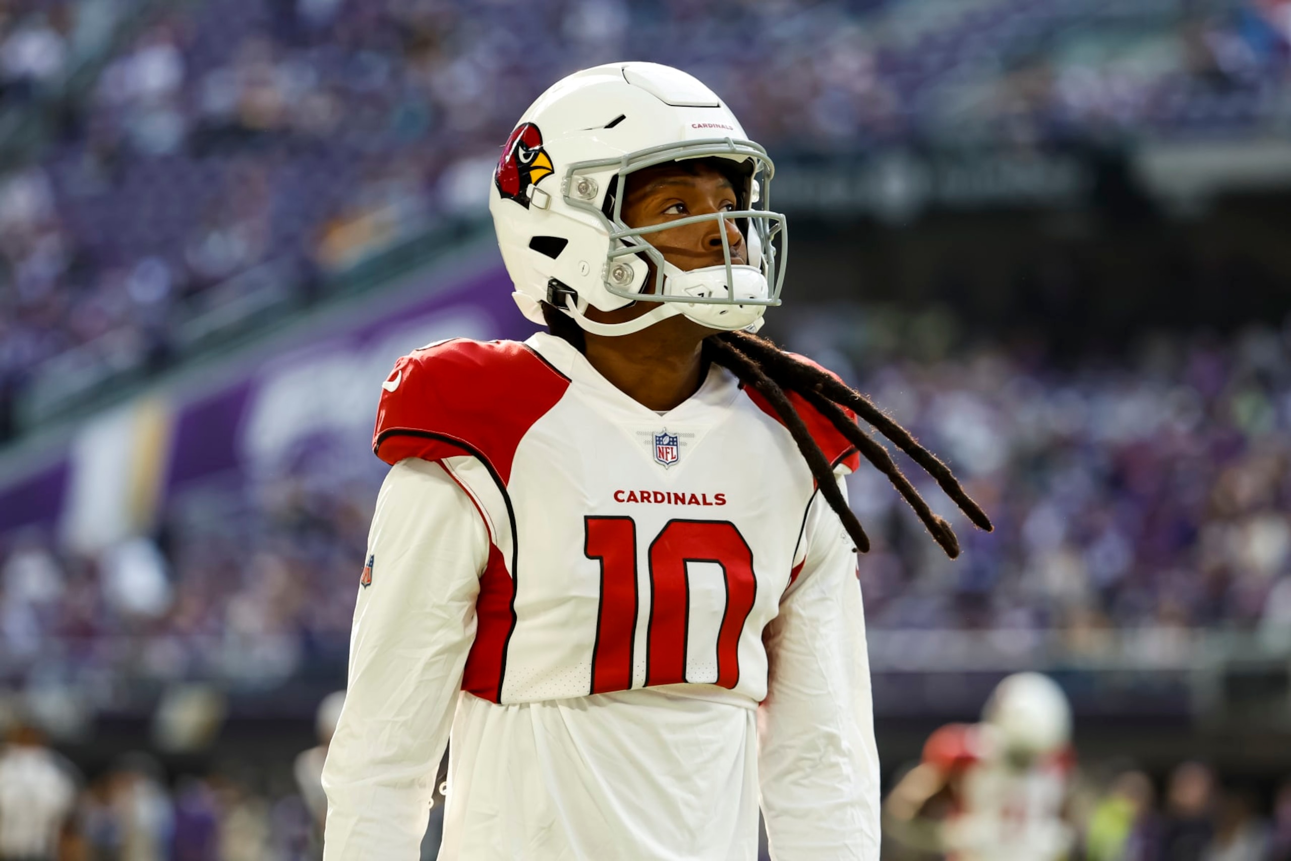 MINNEAPOLIS, MN - OCTOBER 30: DeAndre Hopkins #10 of the Arizona Cardinals looks on before the start of the game against the Minnesota Vikings at U.S. Bank Stadium on October 30, 2022 in Minneapolis, Minnesota. The Vikings defeated the Cardinals 34-26. (Photo by David Berding/Getty Images)