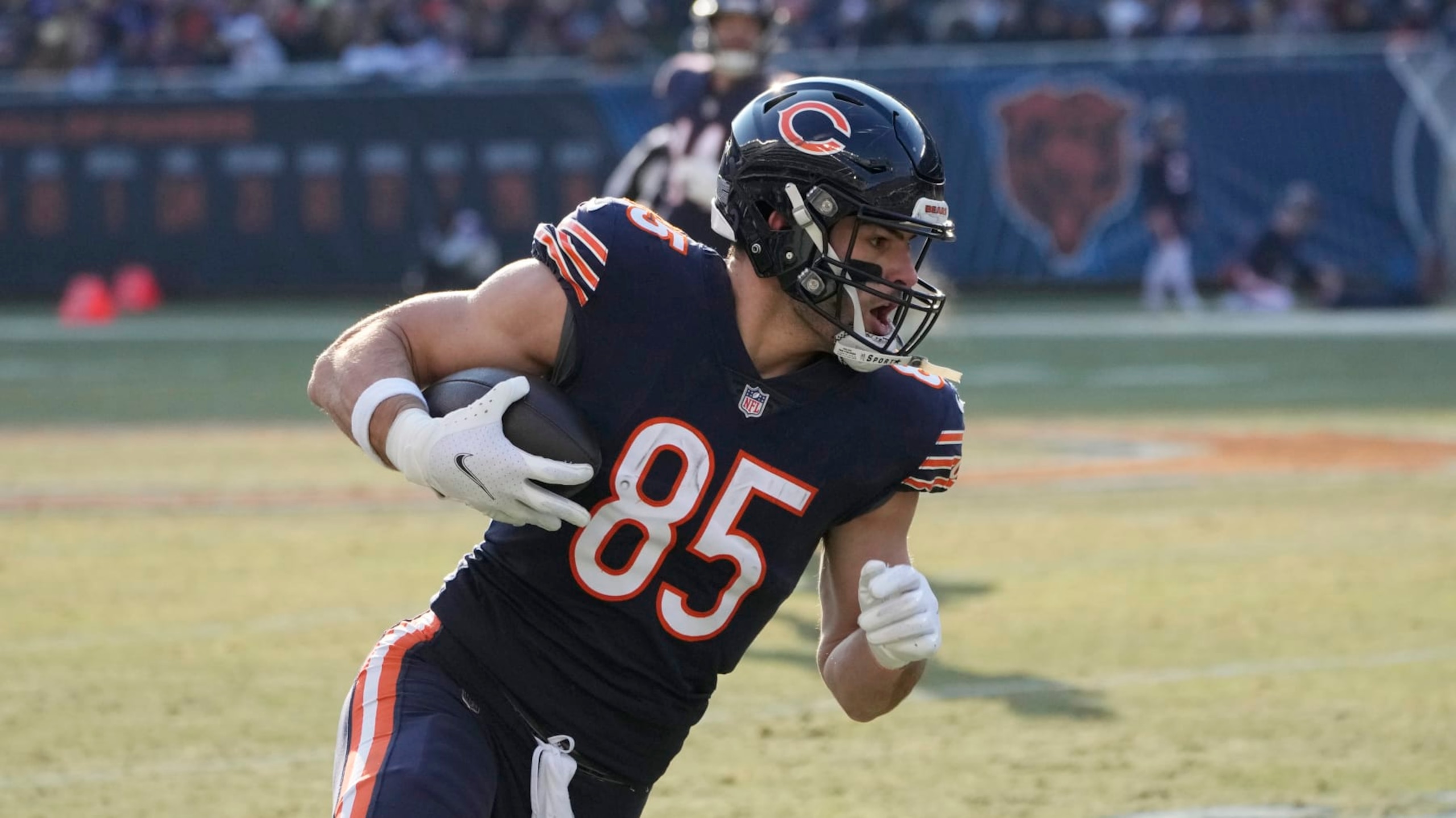 Chicago Bears tight end Cole Kmet runs up field after catching a pass during the second half of an NFL football game against the Minnesota Vikings, Sunday, Jan. 8, 2023, in Chicago. (AP Photo/Charles Rex Arbogast)