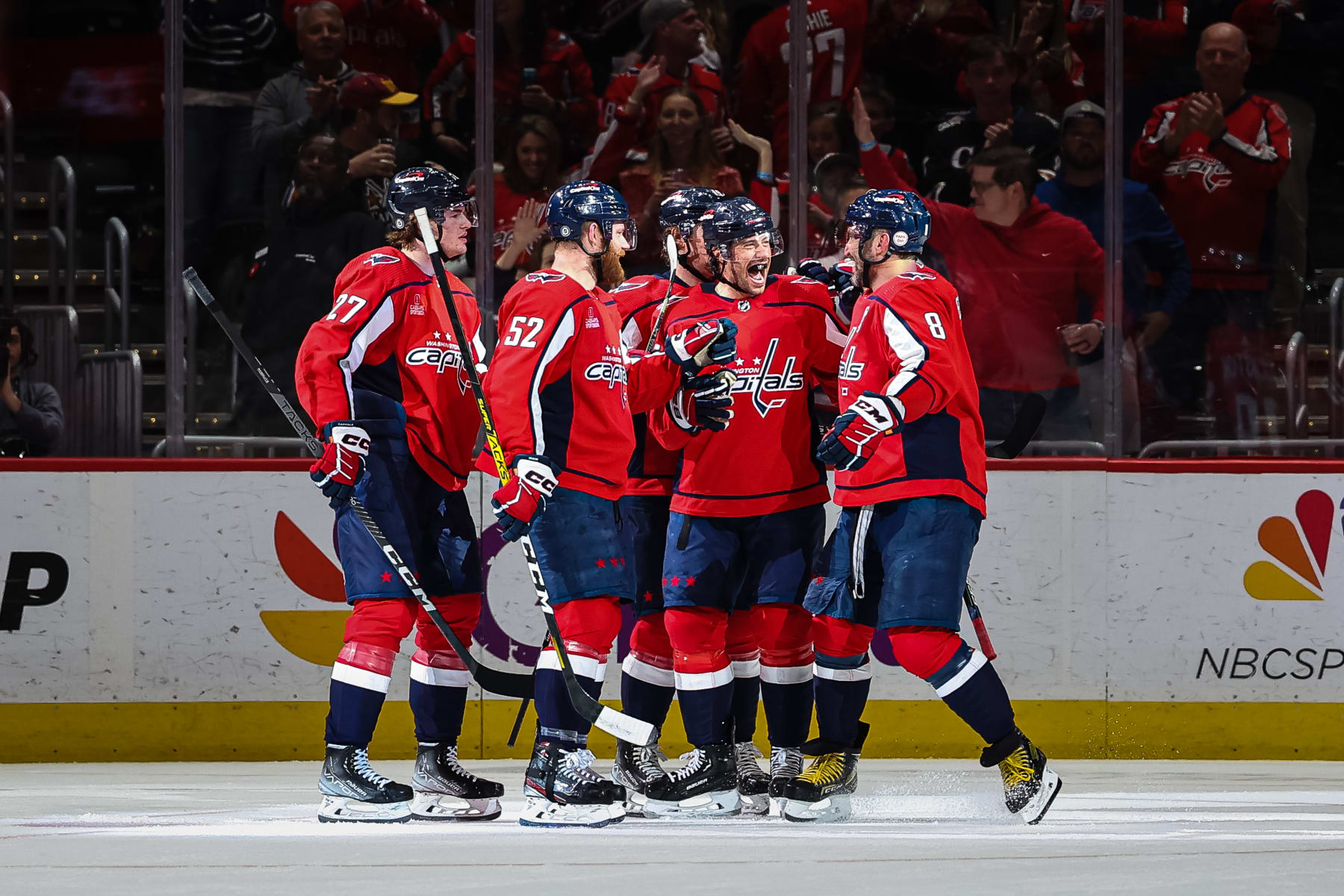 WASHINGTON, DC - APRIL 13: Craig Smith #16 of the Washington Capitals celebrates with Alex Ovechkin #8 and teammates after scoring a goal to record his 200th career NHL goal during the first period of the game against the New Jersey Devils at Capital One Arena on April 13, 2023 in Washington, DC. (Photo by Scott Taetsch/Getty Images)