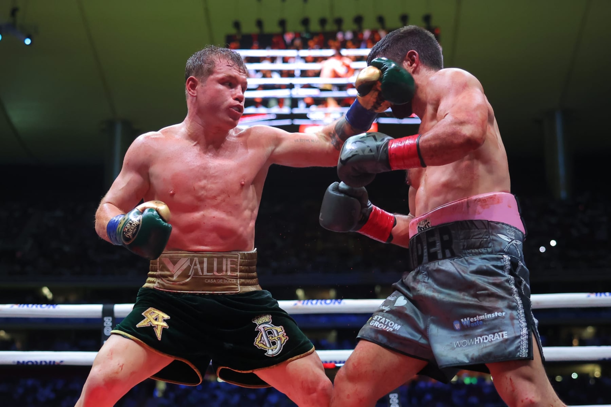 ZAPOPAN, MEXICO - MAY 06: Canelo Alvarez of Mexico punches John Ryder of Great Britain during the fight for the Super Middleweight Championship at Akron Stadium on May 06, 2023 in Zapopan, Mexico. (Photo by Hector Vivas/Getty Images)