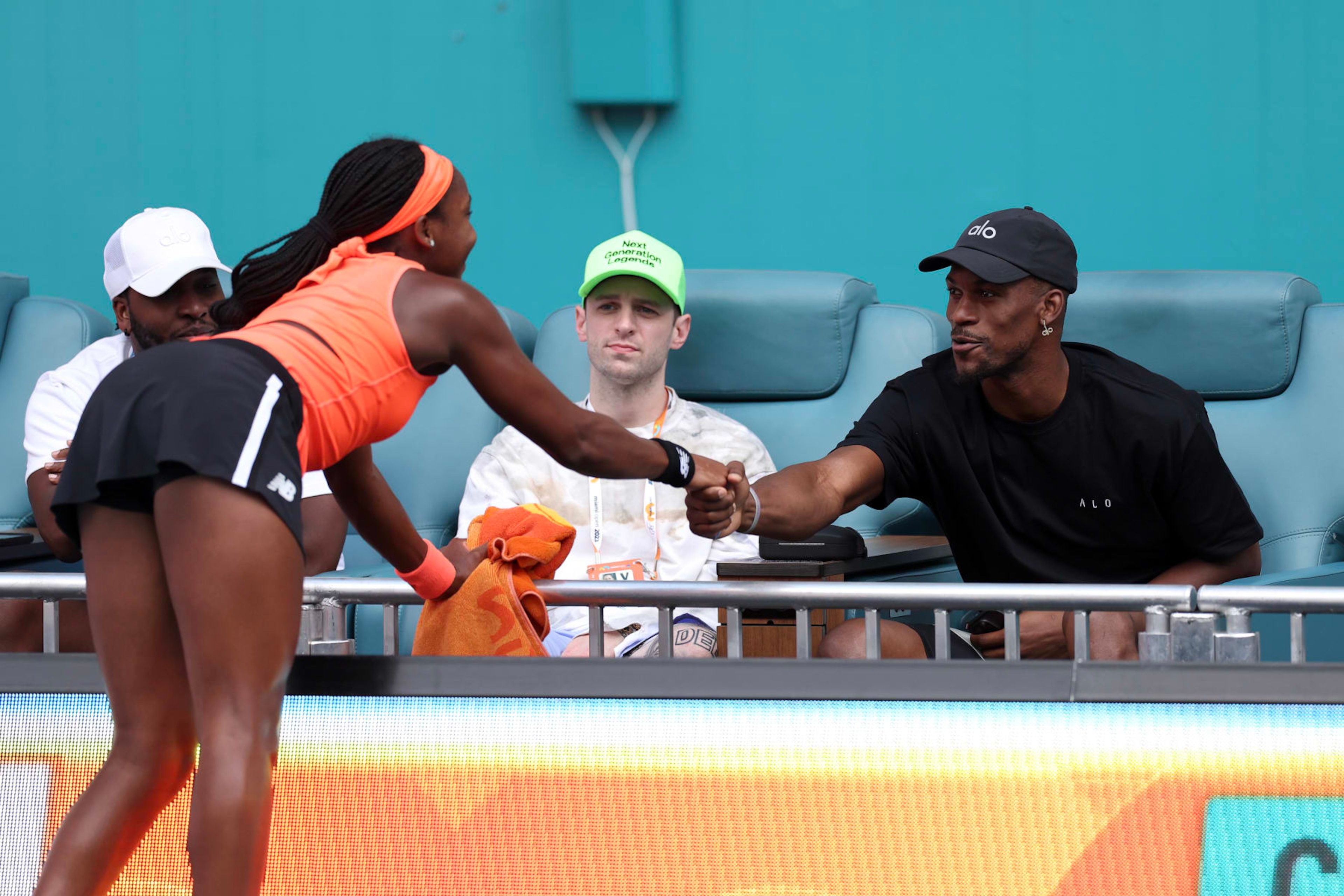 MIAMI GARDENS, FLORIDA - MARCH 23: Jimmy Butler of the Miami Heat greets Coco Gauff of the United States during the Miami Open held at Hard Rock Stadium on March 23, 2023 in Miami Gardens, Florida. (Photo by Tim Nwachukwu/Getty Images) MIAMI GARDENS, FLORIDA - MARCH 23: Jimmy Butler of the Miami Heat greets Coco Gauff of the United States during the Miami Open held at Hard Rock Stadium on March 23, 2023 in Miami Gardens, Florida. (Photo by Tim Nwachukwu/Getty Images)