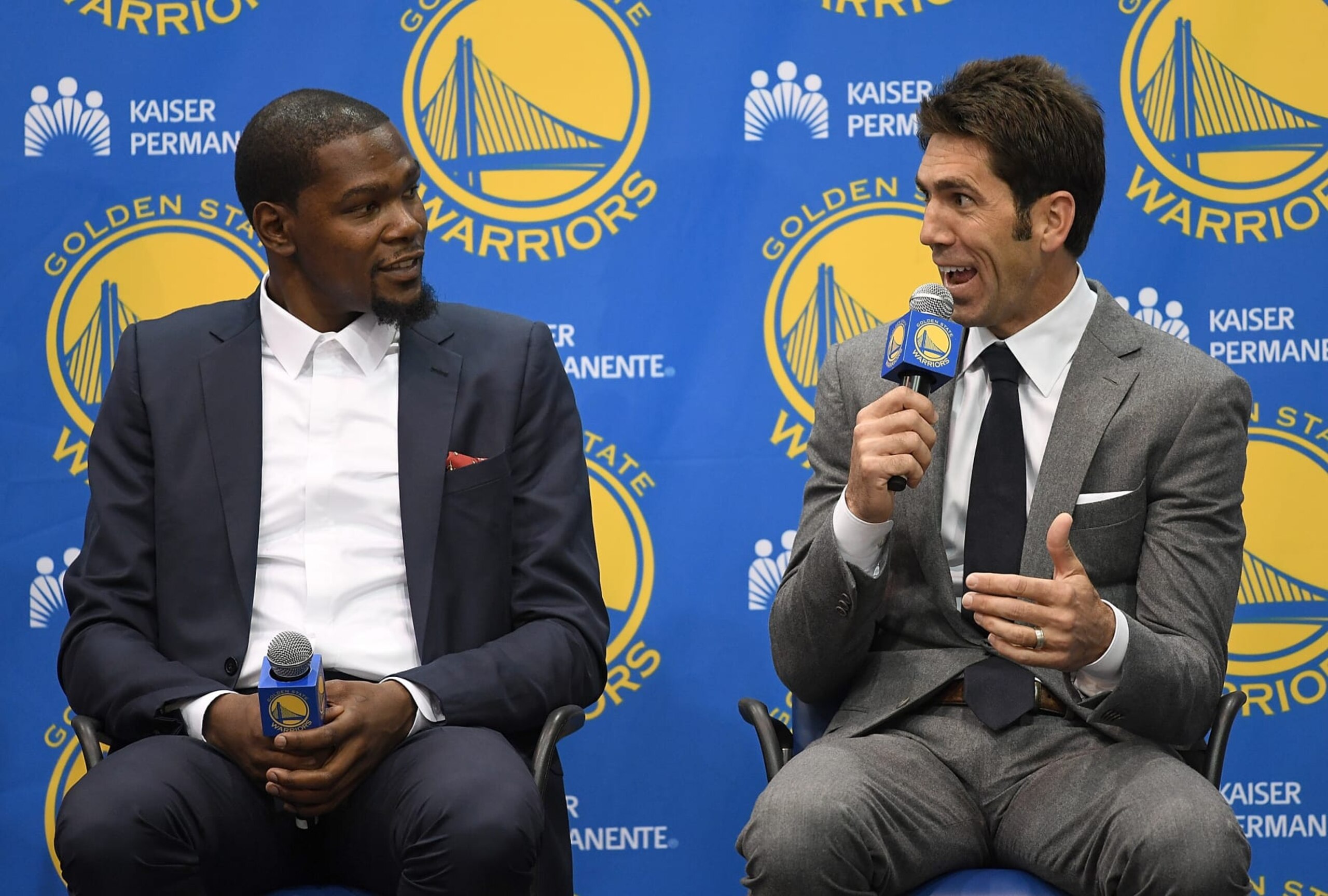 OAKLAND, CA - JULY 07: Kevin Durant sits with general manager Bob Myers of the Golden State Warriors while they speak to the media during the press conference where Durant was introduced as a Golden State Warrior after they signed him as a free agent on July 7, 2016 in Oakland, California. (Photo by Thearon W. Henderson/Getty Images) OAKLAND, CA - JULY 07: Kevin Durant sits with general manager Bob Myers of the Golden State Warriors while they speak to the media during the press conference where Durant was introduced as a Golden State Warrior after they signed him as a free agent on July 7, 2016 in Oakland, California. (Photo by Thearon W. Henderson/Getty Images)