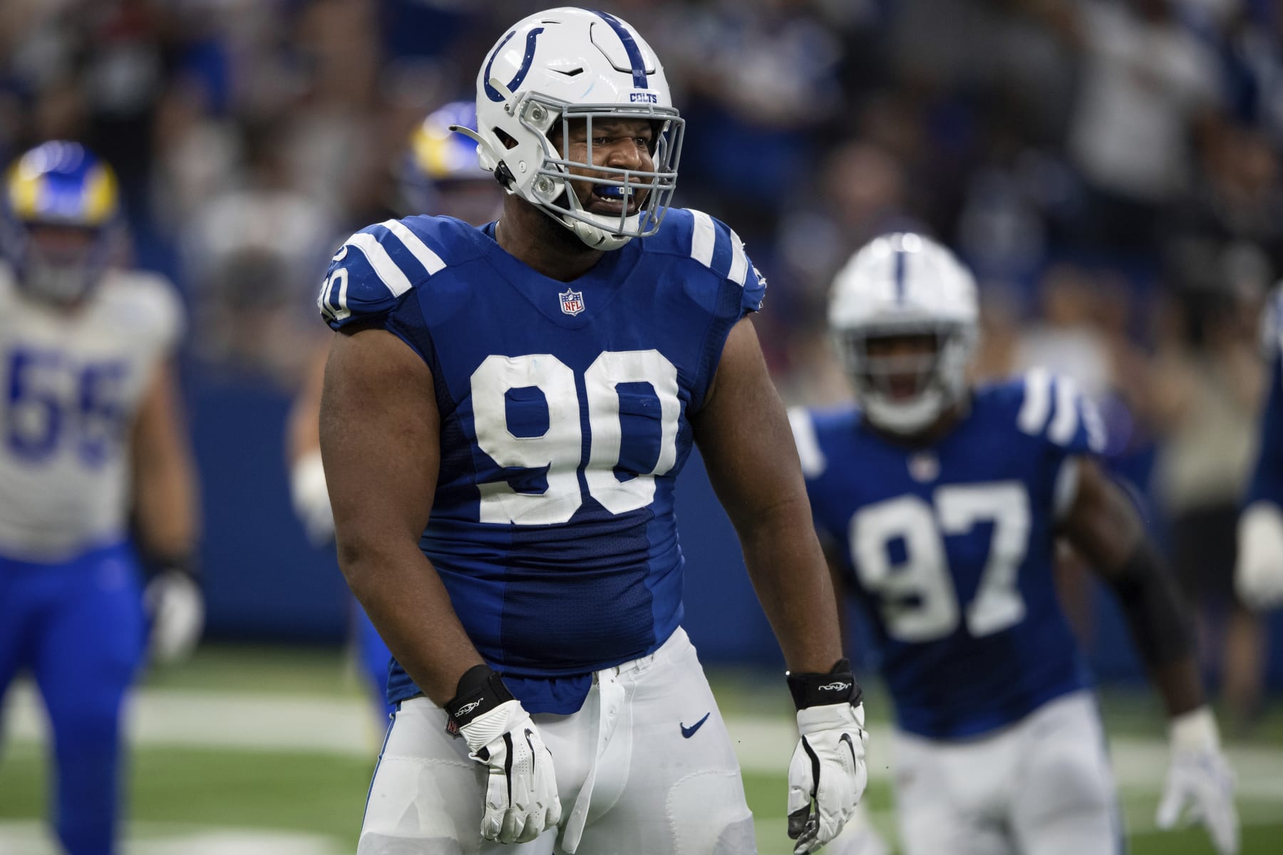 Indianapolis Colts defensive tackle Grover Stewart (90) reacts to a defensive stop during an NFL football game against the Los Angeles Rams, Sunday, Sept. 19, 2021, in Indianapolis. (AP Photo/Zach Bolinger)