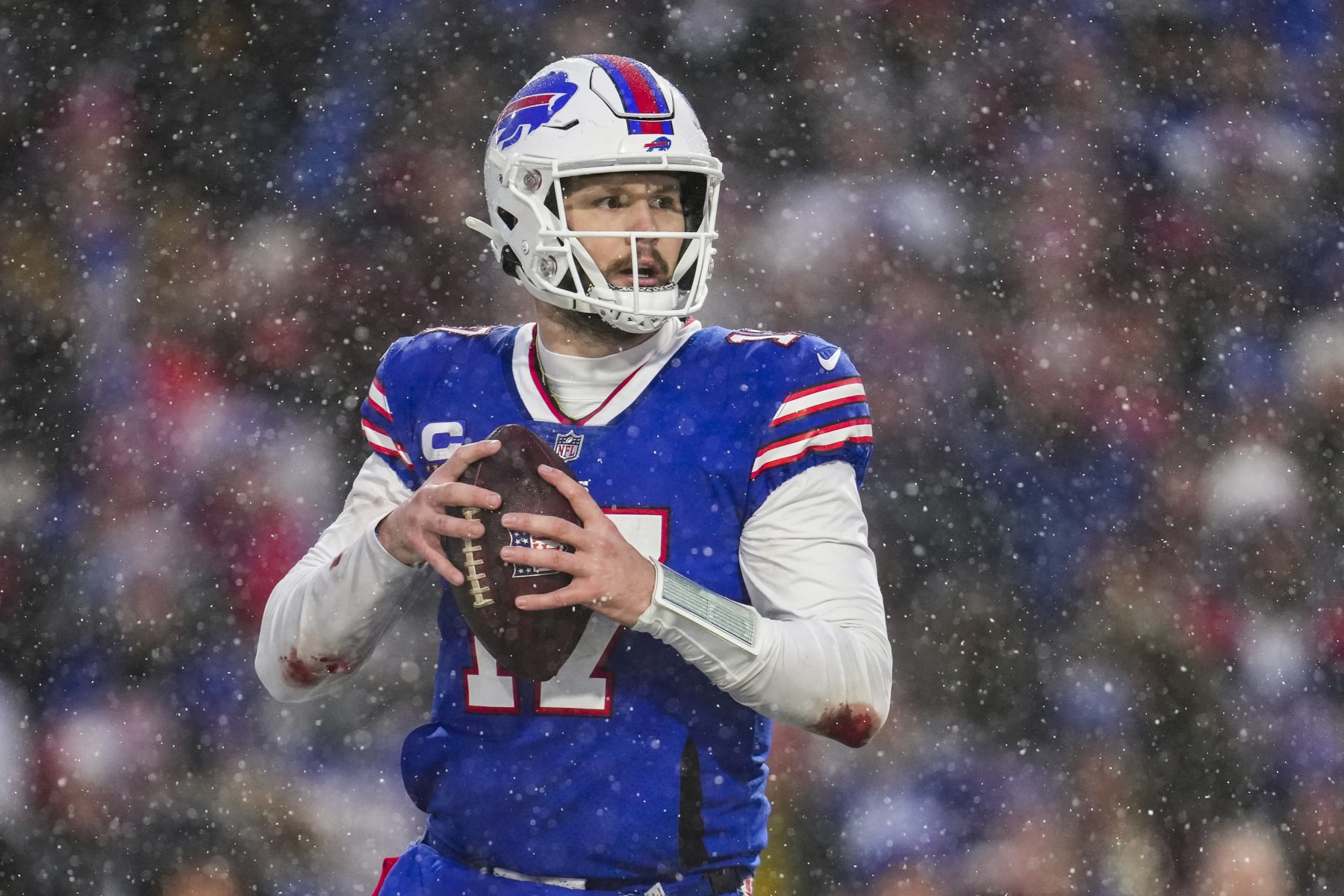 ORCHARD PARK, NY - JANUARY 22: Josh Allen #17 of the Buffalo Bills looks to pass against the Cincinnati Bengals at Highmark Stadium on January 22, 2023 in Orchard Park, New York. (Photo by Cooper Neill/Getty Images)