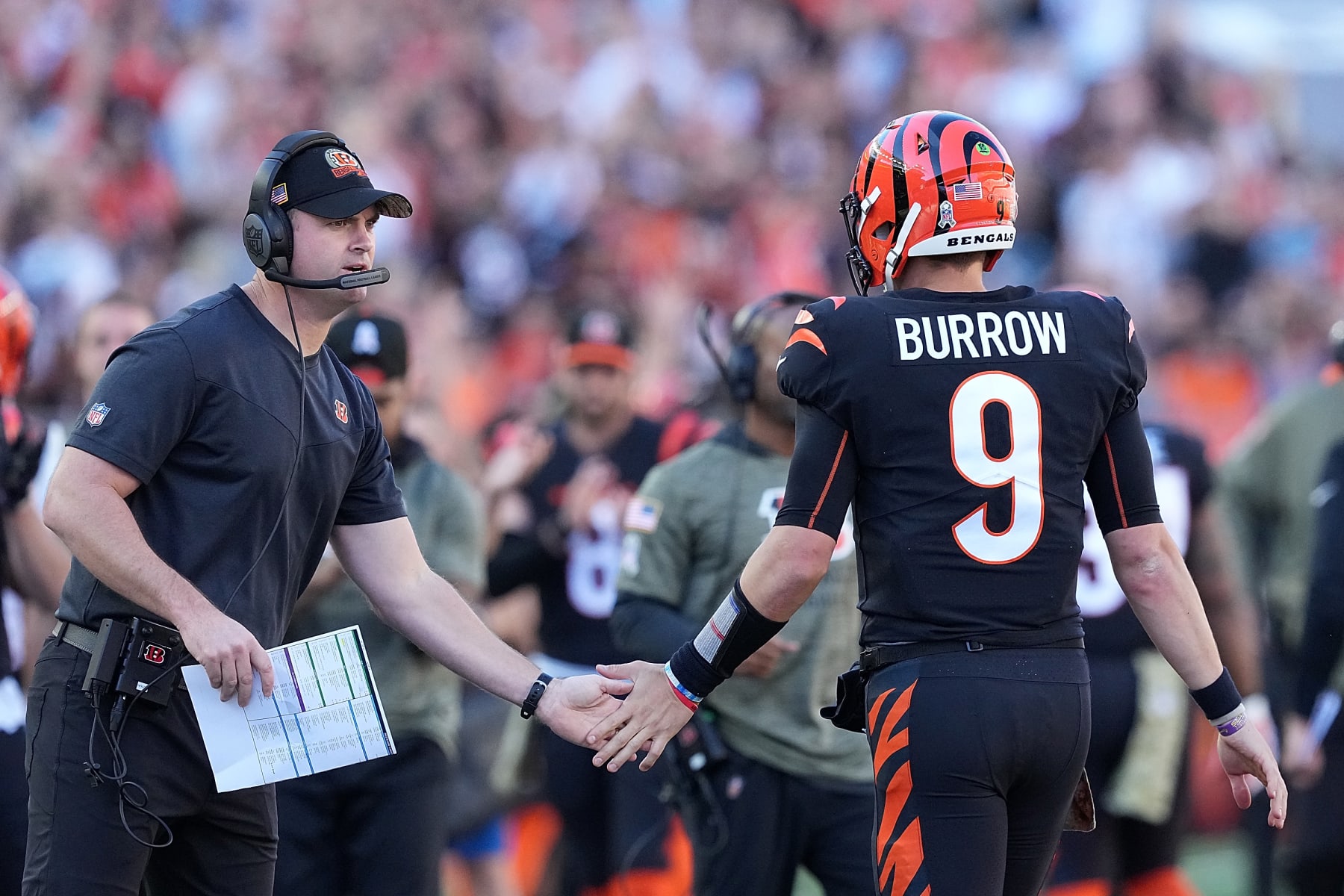 CINCINNATI, OHIO - NOVEMBER 06: Head coach Zac Taylor and Joe Burrow #9 of the Cincinnati Bengals celebrate after a touchdown during the first half in the game against the Carolina Panthers at Paycor Stadium on November 06, 2022 in Cincinnati, Ohio. (Photo by Dylan Buell/Getty Images)