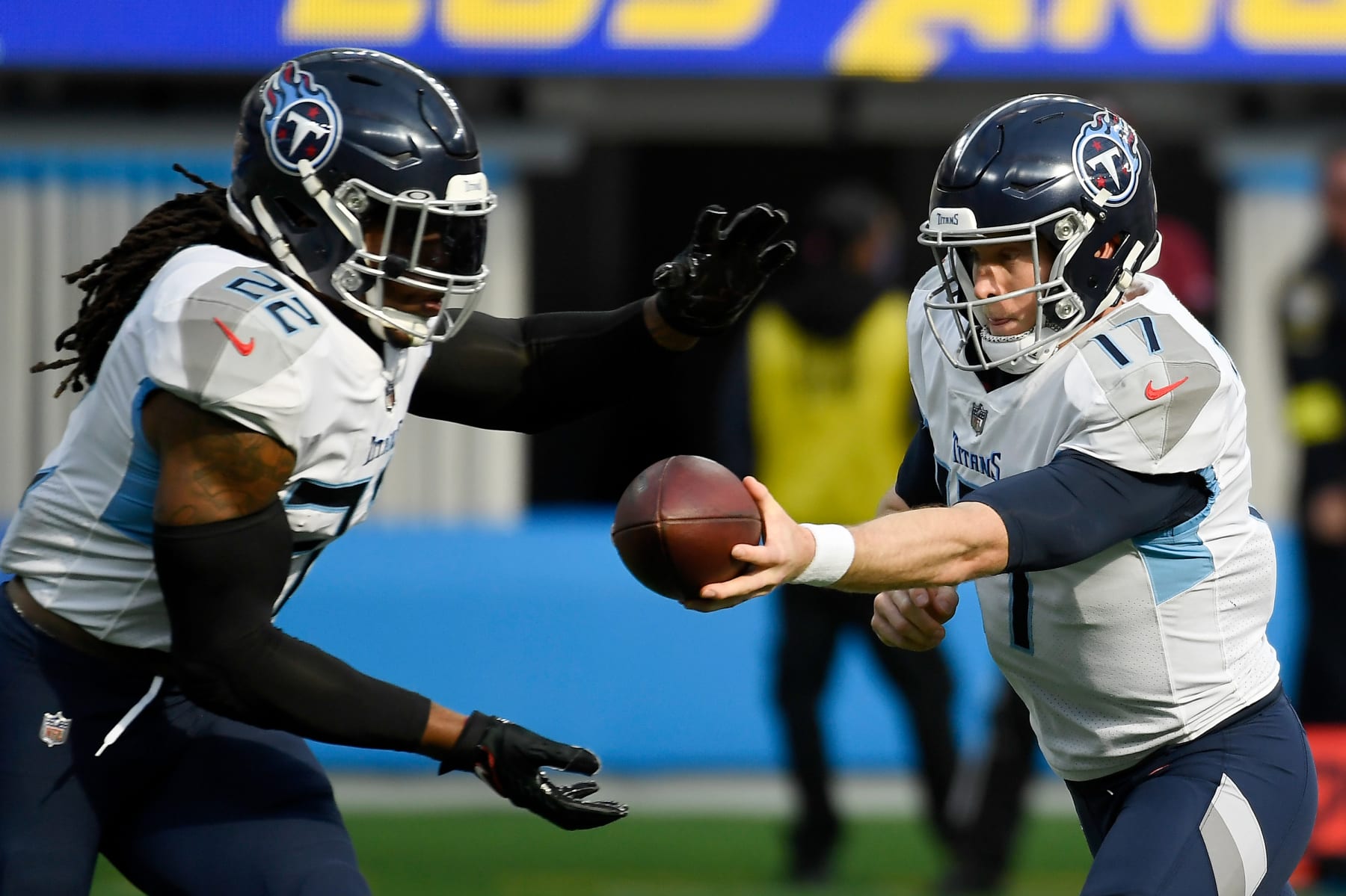 INGLEWOOD, CALIFORNIA - DECEMBER 18: Ryan Tannehill #17 of the Tennessee Titans hands off the ball to Derrick Henry #22 during the first half of the game against the Los Angeles Chargers at SoFi Stadium on December 18, 2022 in Inglewood, California. (Photo by Kevork Djansezian/Getty Images)