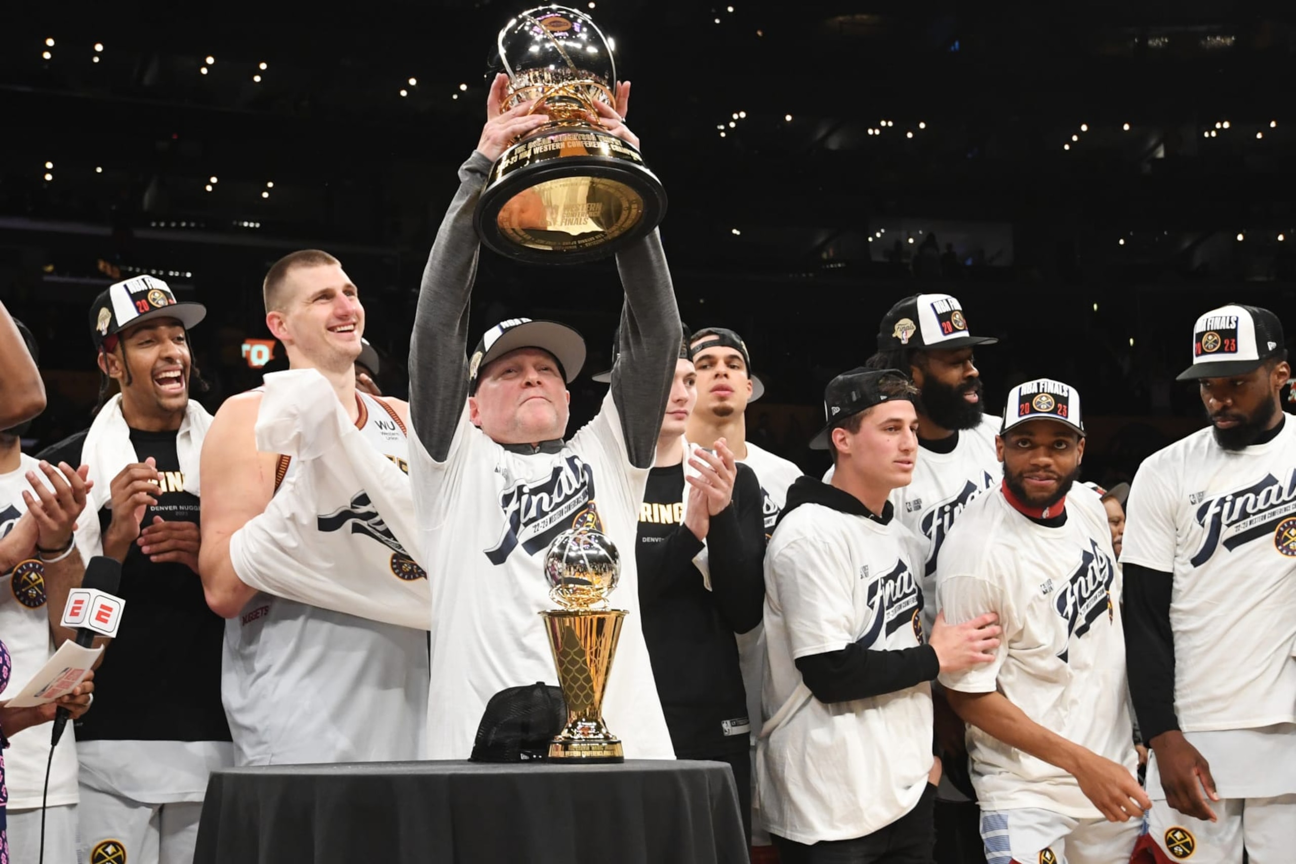 LOS ANGELES, CA - MAY 22: Head Coach Michael Malone of the Denver Nuggets displays the Oscar Robertson Western Conference trophy after Round 3 Game 4 of the Western Conference Finals 2023 NBA Playoffs against the Los Angeles Lakers on May 22, 2023 at Crypto.Com Arena in Los Angeles, California. NOTE TO USER: User expressly acknowledges and agrees that, by downloading and/or using this Photograph, user is consenting to the terms and conditions of the Getty Images License Agreement. Mandatory Copyright Notice: Copyright 2023 NBAE (Photo by Andrew D. Bernstein/NBAE via Getty Images)