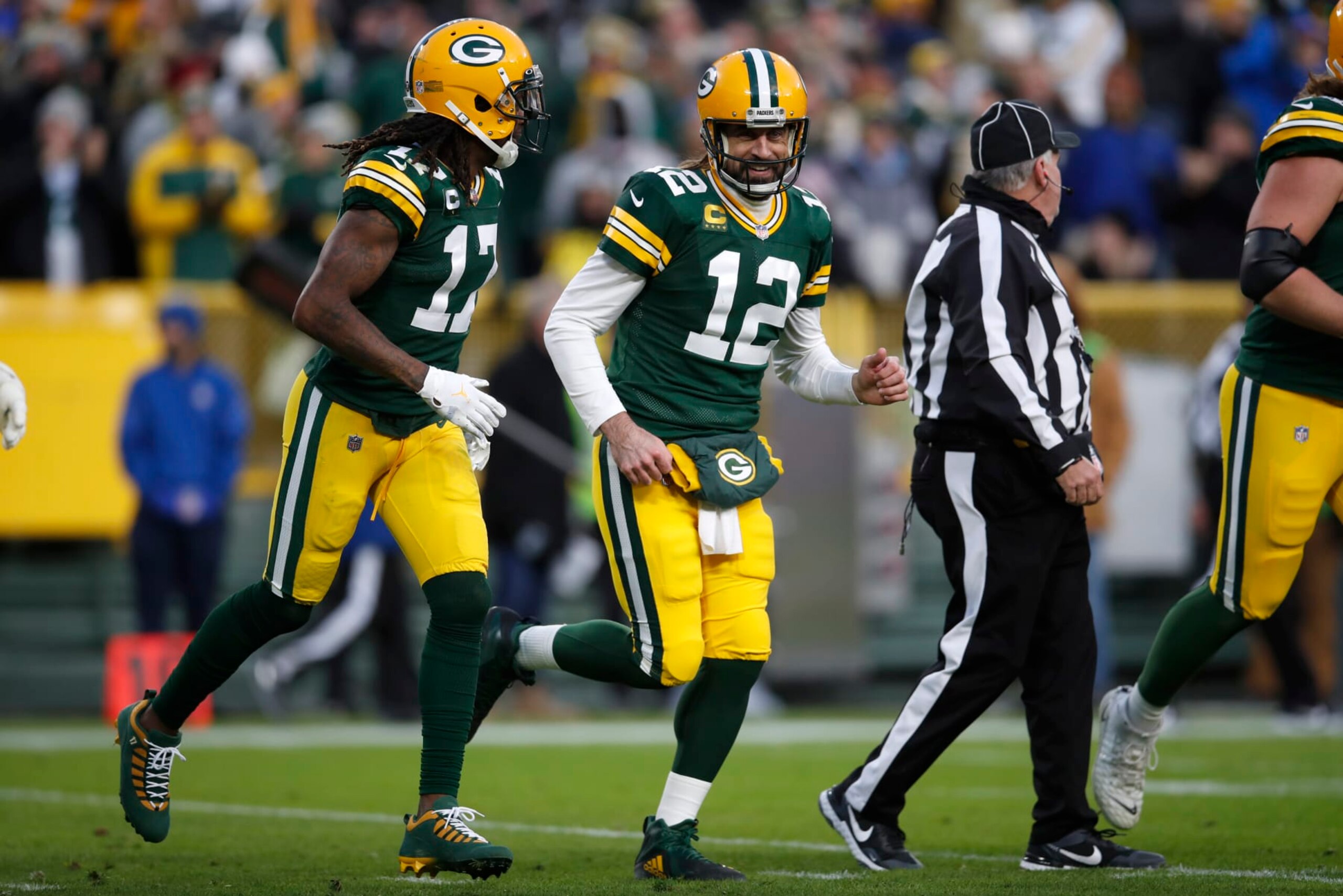Green Bay Packers quarterback Aaron Rodgers (12) and wide receiver Davante Adams (17) run off the field after a touchdown against the Los Angeles Rams during an NFL football game Sunday, Nov. 28, 2021, in Green Bay, Wis. The Packers defeated the Rams 36-28. (Jeff Haynes/AP Images for Panini)