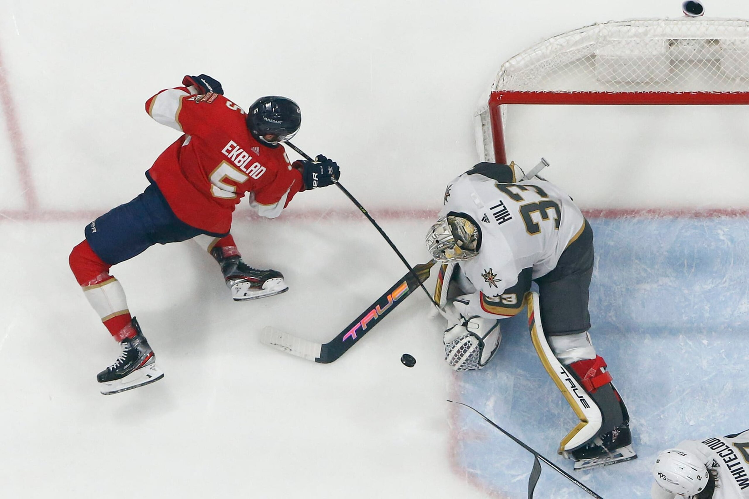 SUNRISE, FL - MARCH 7: Goaltender Adin Hill #33 of the Vegas Golden Knights stops a shot by Aaron Ekblad #5 of the Florida Panthers at the FLA Live Arena on March 7, 2023 in Sunrise, Florida. (Photo by Joel Auerbach/Getty Images) SUNRISE, FL - MARCH 7: Goaltender Adin Hill #33 of the Vegas Golden Knights stops a shot by Aaron Ekblad #5 of the Florida Panthers at the FLA Live Arena on March 7, 2023 in Sunrise, Florida. (Photo by Joel Auerbach/Getty Images)