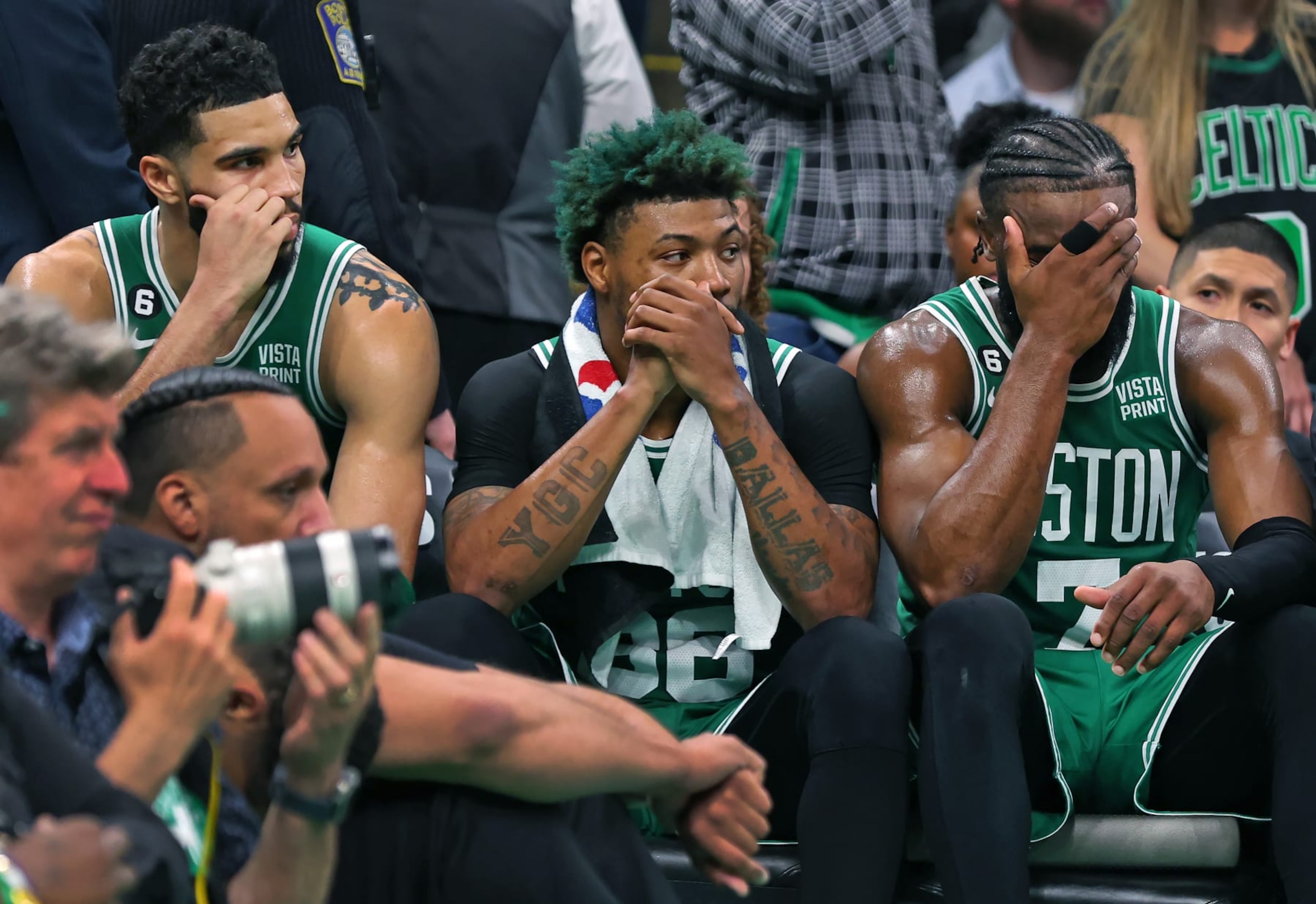 Boston, MA - May 29: Boston Celtics Jayson Tatum, Marcus Smart and Jaylen Brown watch the game from the bench in the fourth quarter. The Miami Heat beat the Celtics, 103-84, in Game 7 of the 2023 Eastern Conference Finals. (Photo by Jim Davis/The Boston Globe via Getty Images)
