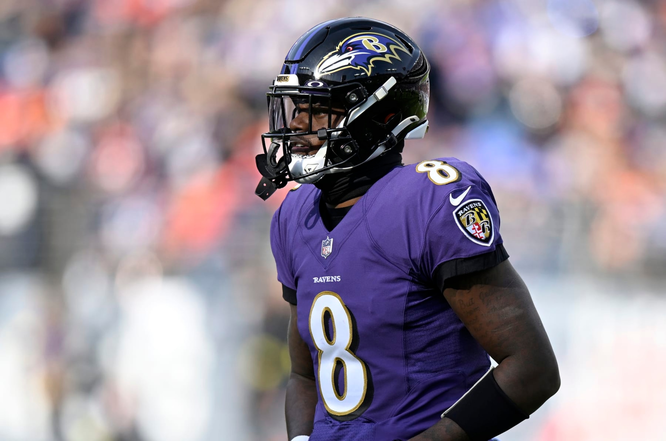 BALTIMORE, MARYLAND - DECEMBER 04: Lamar Jackson #8 of the Baltimore Ravens walks across the field during the game against the Denver Broncos at M&T Bank Stadium on December 04, 2022 in Baltimore, Maryland. (Photo by G Fiume/Getty Images)