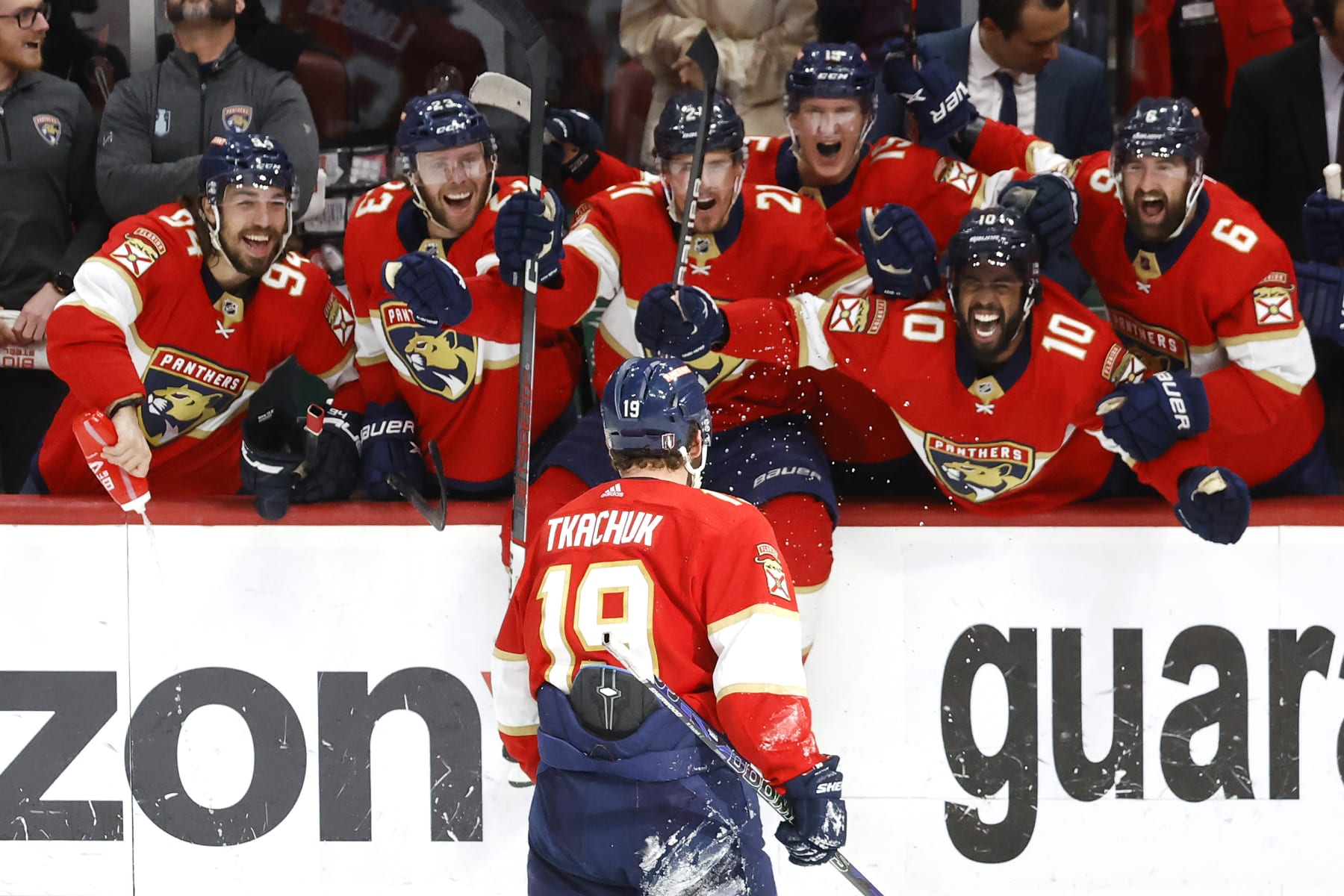 SUNRISE, FLORIDA - MAY 24: Matthew Tkachuk #19 of the Florida Panthers celebrates with his teammates after scoring the game winning goal on Frederik Andersen #31 of the Carolina Hurricanes during the third period in Game Four of the Eastern Conference Final of the 2023 Stanley Cup Playoffs at FLA Live Arena on May 24, 2023 in Sunrise, Florida. (Photo by Joel Auerbach/Getty Images)