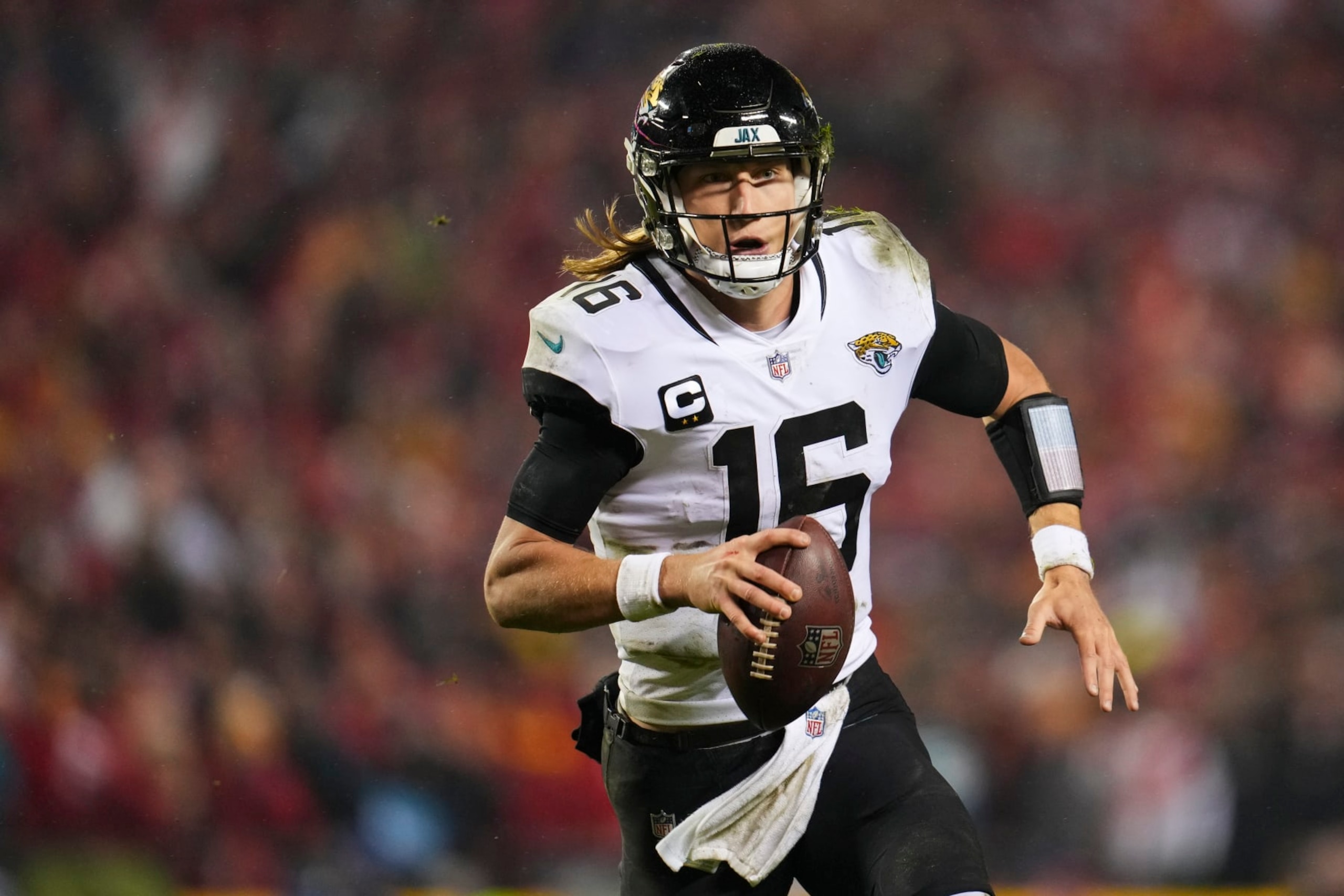 KANSAS CITY, MO - JANUARY 21: Trevor Lawrence #16 of the Jacksonville Jaguars scrambles against the Kansas City Chiefs at GEHA Field at Arrowhead Stadium on January 21, 2023 in Kansas City, Missouri. (Photo by Cooper Neill/Getty Images)