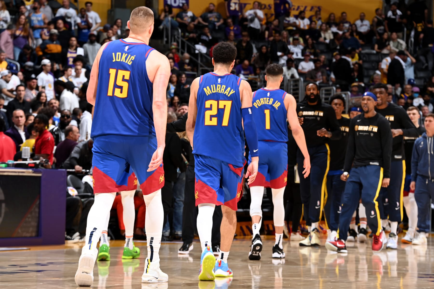 LOS ANGELES, CA - MAY 20: Nikola Jokic #15, Jamal Murray #27, and Michael Porter Jr. #1 of the Denver Nuggets walk off the court during Game 3 of the 2023 NBA Playoffs Western Conference Finals on May 20, 2023 at Crypto.Com Arena in Los Angeles, California. NOTE TO USER: User expressly acknowledges and agrees that, by downloading and/or using this Photograph, user is consenting to the terms and conditions of the Getty Images License Agreement. Mandatory Copyright Notice: Copyright 2023 NBAE (Photo by Andrew D. Bernstein/NBAE via Getty Images)