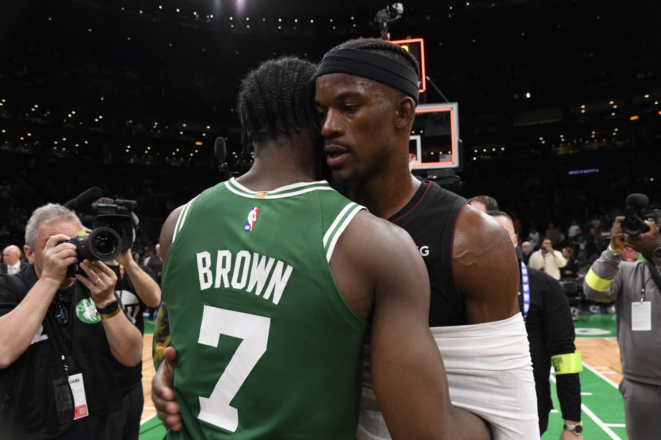BOSTON, MA - MAY 29: Jimmy Butler #22 of the Miami Heat embraces Jaylen Brown #7 of the Boston Celtics after round 3 game 7 of the Eastern Conference finals 2023 NBA Playoffs on May 29, 2023 at the TD Garden in Boston, Massachusetts. NOTE TO USER: User expressly acknowledges and agrees that, by downloading and or using this photograph, User is consenting to the terms and conditions of the Getty Images License Agreement. Mandatory Copyright Notice: Copyright 2023 NBAE  (Photo by Brian Babineau/NBAE via Getty Images)