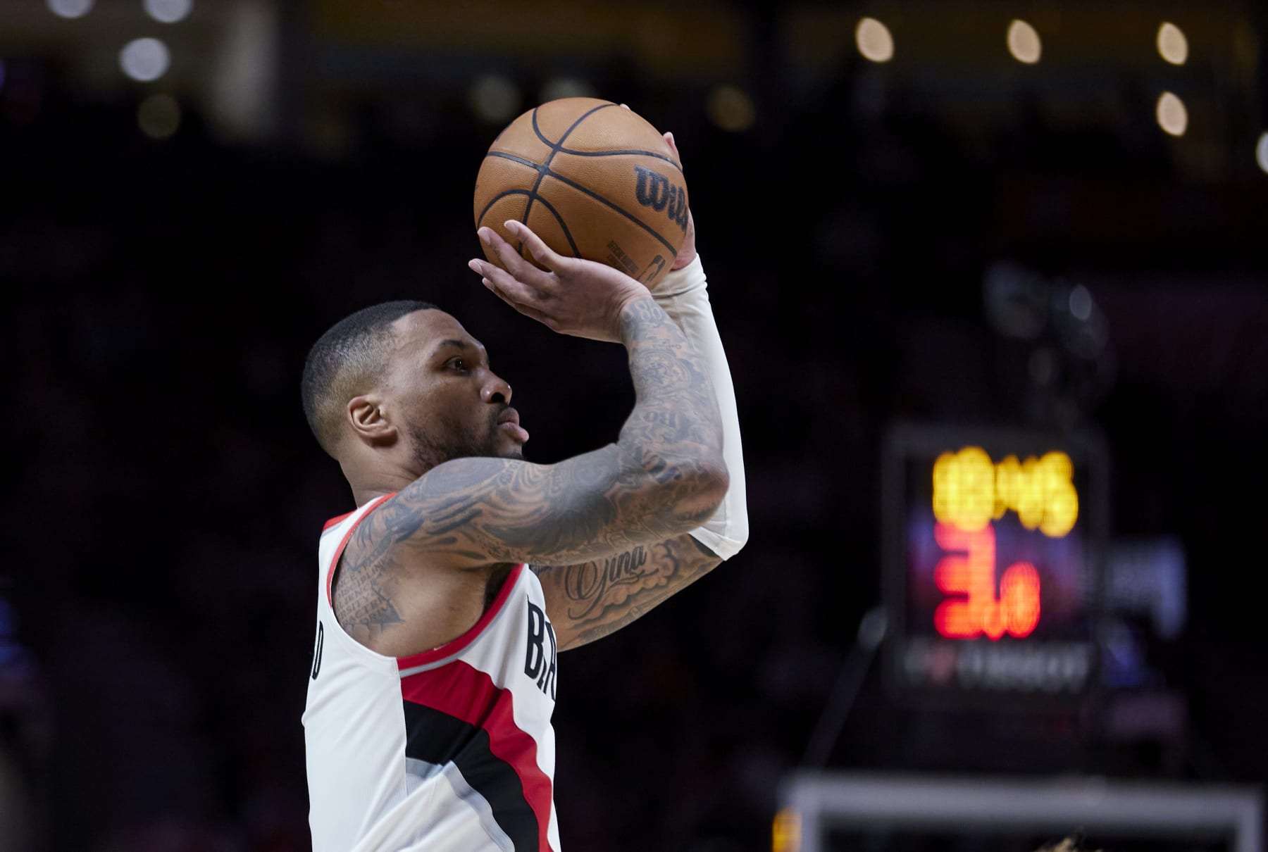 Portland Trail Blazers guard Damian Lillard shoots a 3-point basket against the New York Knicks during the second half of an NBA basketball game in Portland, Ore., Tuesday, March 14, 2023. (AP Photo/Craig Mitchelldyer)