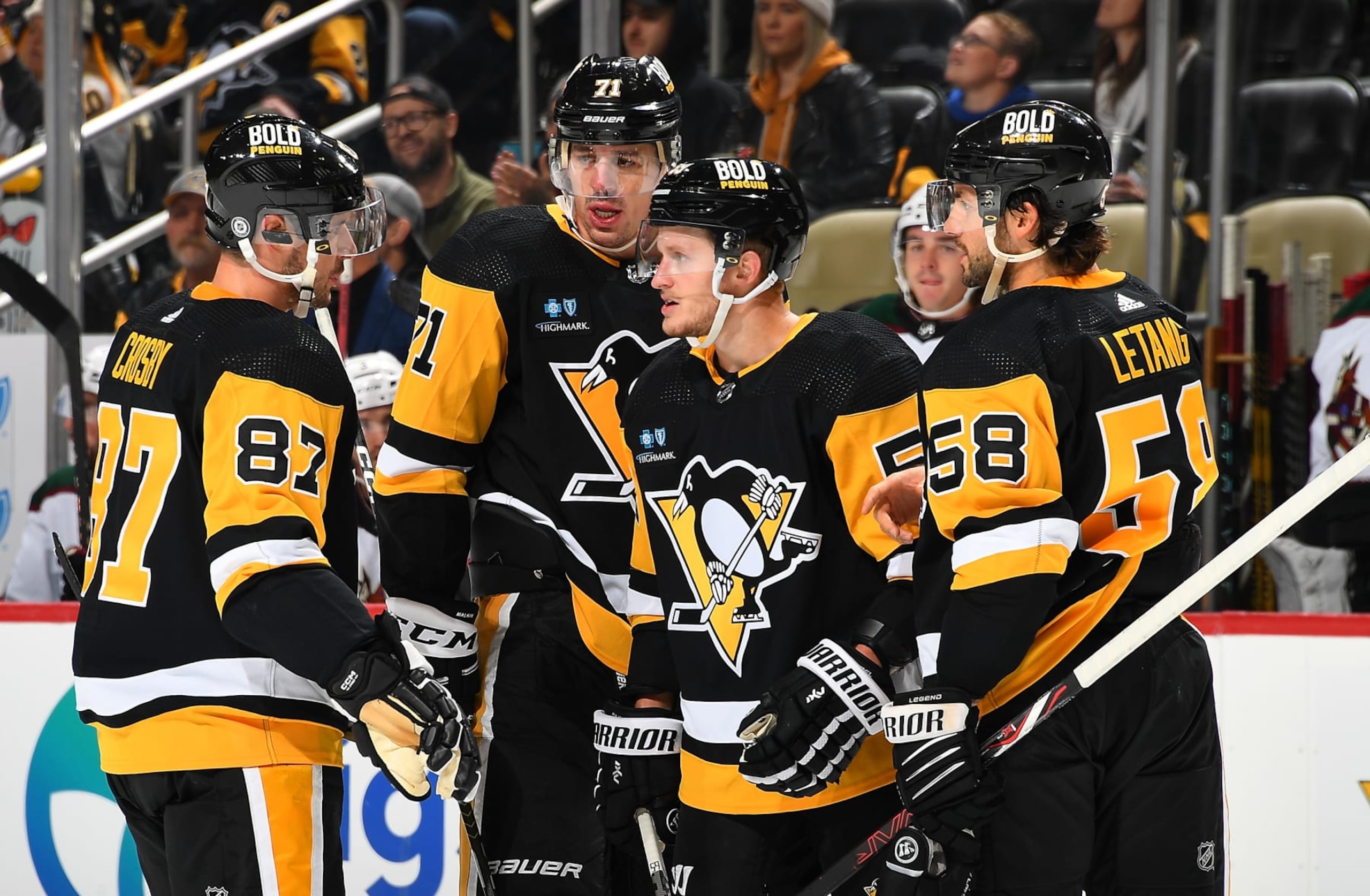 PITTSBURGH, PA - OCTOBER 13: Sidney Crosby #87 talks with Jake Guentzel #59, Evgeni Malkin #71 and Kris Letang #58 of the Pittsburgh Penguins during the game against the Arizona Coyotes at PPG PAINTS Arena on October 13, 2022 in Pittsburgh, Pennsylvania. (Photo by Joe Sargent/NHLI via Getty Images) PITTSBURGH, PA - OCTOBER 13: Sidney Crosby #87 talks with Jake Guentzel #59, Evgeni Malkin #71 and Kris Letang #58 of the Pittsburgh Penguins during the game against the Arizona Coyotes at PPG PAINTS Arena on October 13, 2022 in Pittsburgh, Pennsylvania. (Photo by Joe Sargent/NHLI via Getty Images)