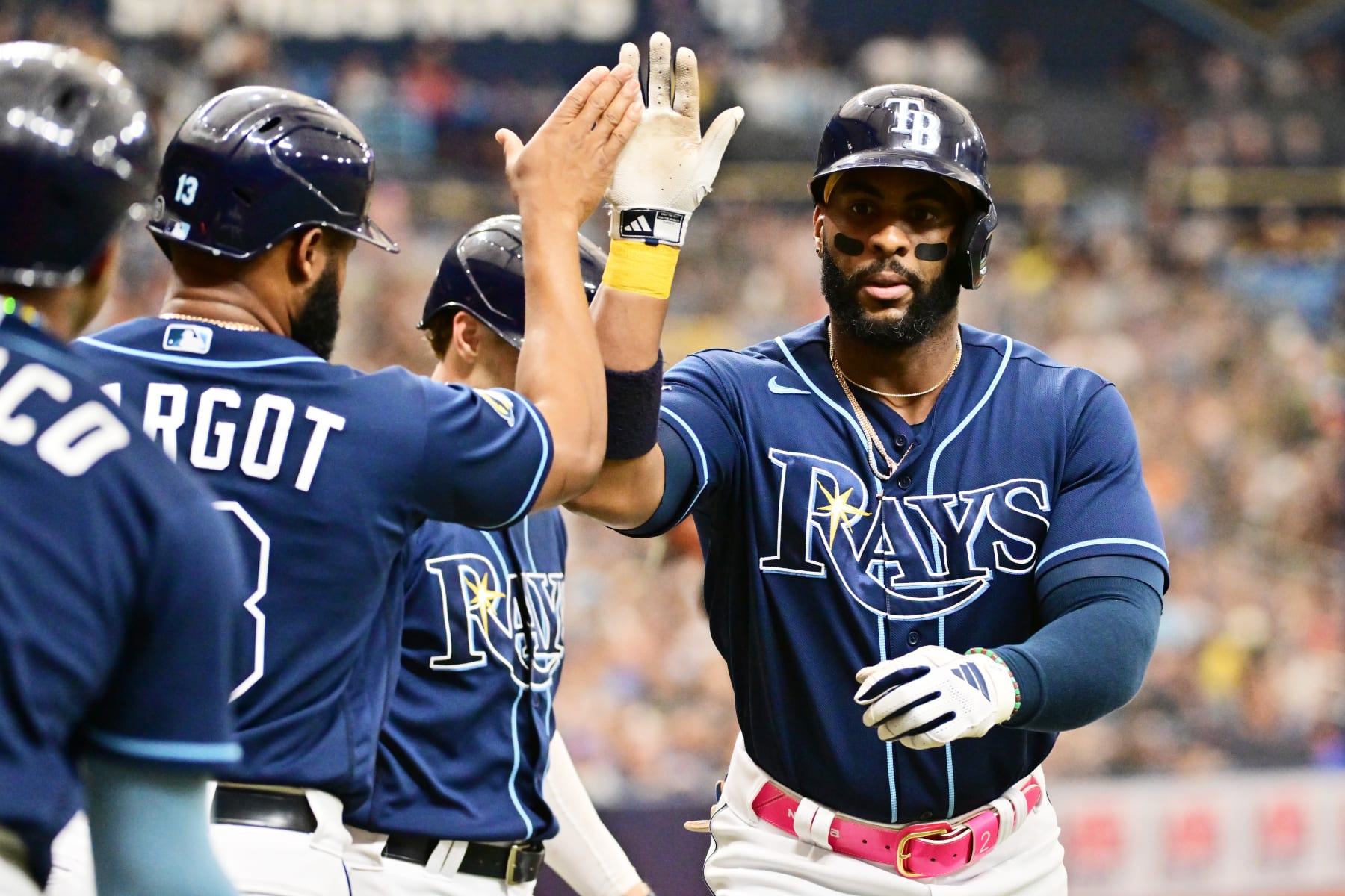 ST PETERSBURG, FLORIDA - MAY 20: Yandy Diaz #2 of the Tampa Bay Rays celebrates with Manuel Margot #13 after hitting a 3-run home run in the second inning against the Milwaukee Brewers at Tropicana Field on May 20, 2023 in St Petersburg, Florida. (Photo by Julio Aguilar/Getty Images)
