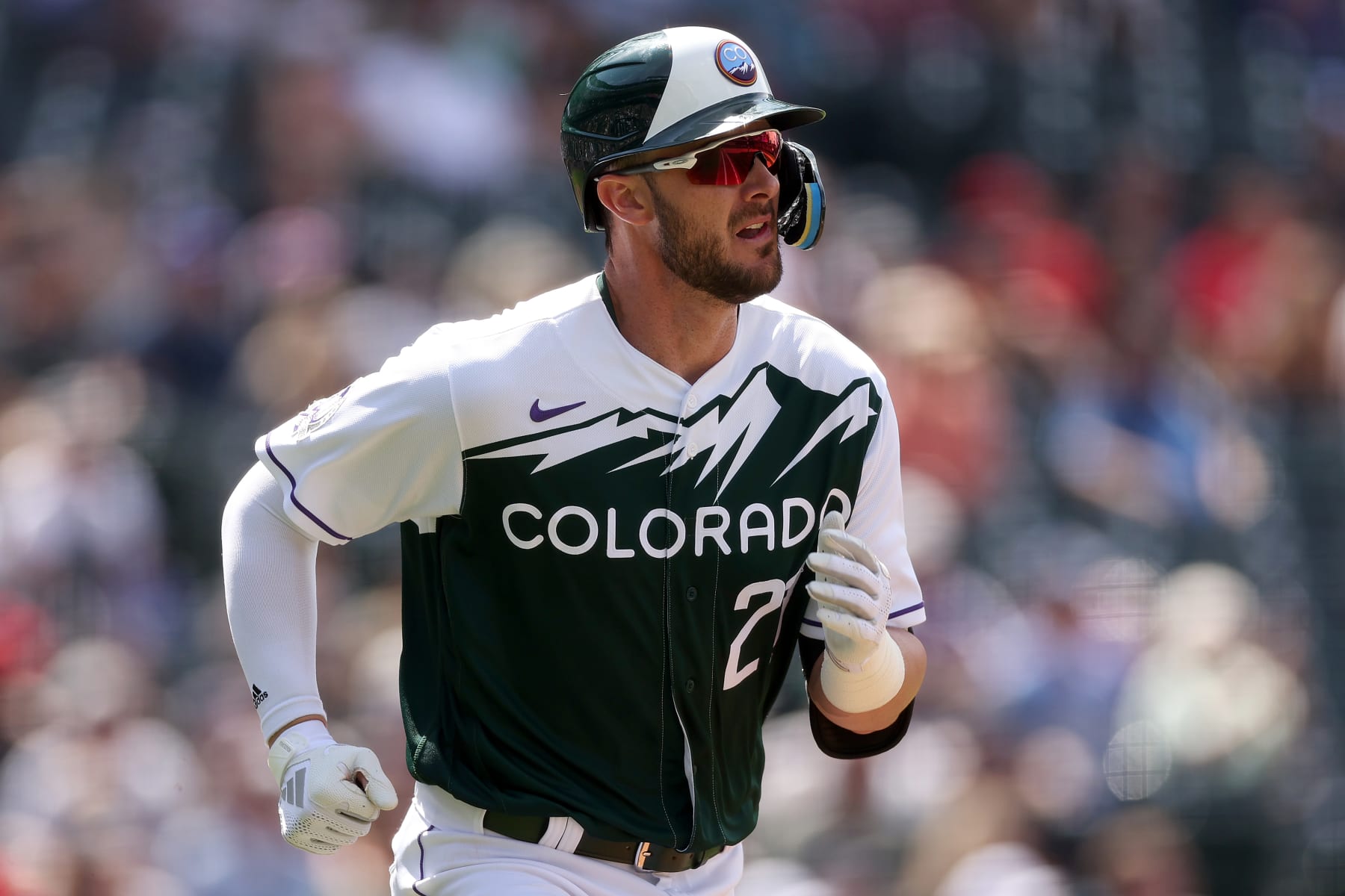 DENVER, COLORADO - MAY 17: Kris Bryant #23 of the Colorado Rockies hits a 2 RBI single against the Cincinnati Reds in the sixth inning at Coors Field on May 17, 2023 in Denver, Colorado. (Photo by Matthew Stockman/Getty Images)