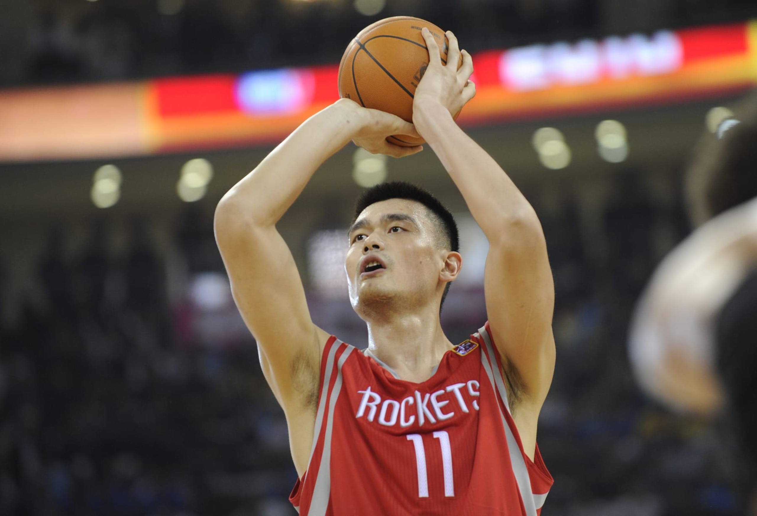 Houston Rockets All-Star Yao Ming takes a penalty shot during their match against the New Jersey Nets in the NBA China Games 2010 basketball match at the Wukesong Arena in Beijing on October 13, 2010. The Rockets and Nets will play two exhibition games in China in Beijing and Guangzhou International Sports Arena on October 16. AFP PHOTO/Peter PARKS (Photo credit should read PETER PARKS/AFP via Getty Images)