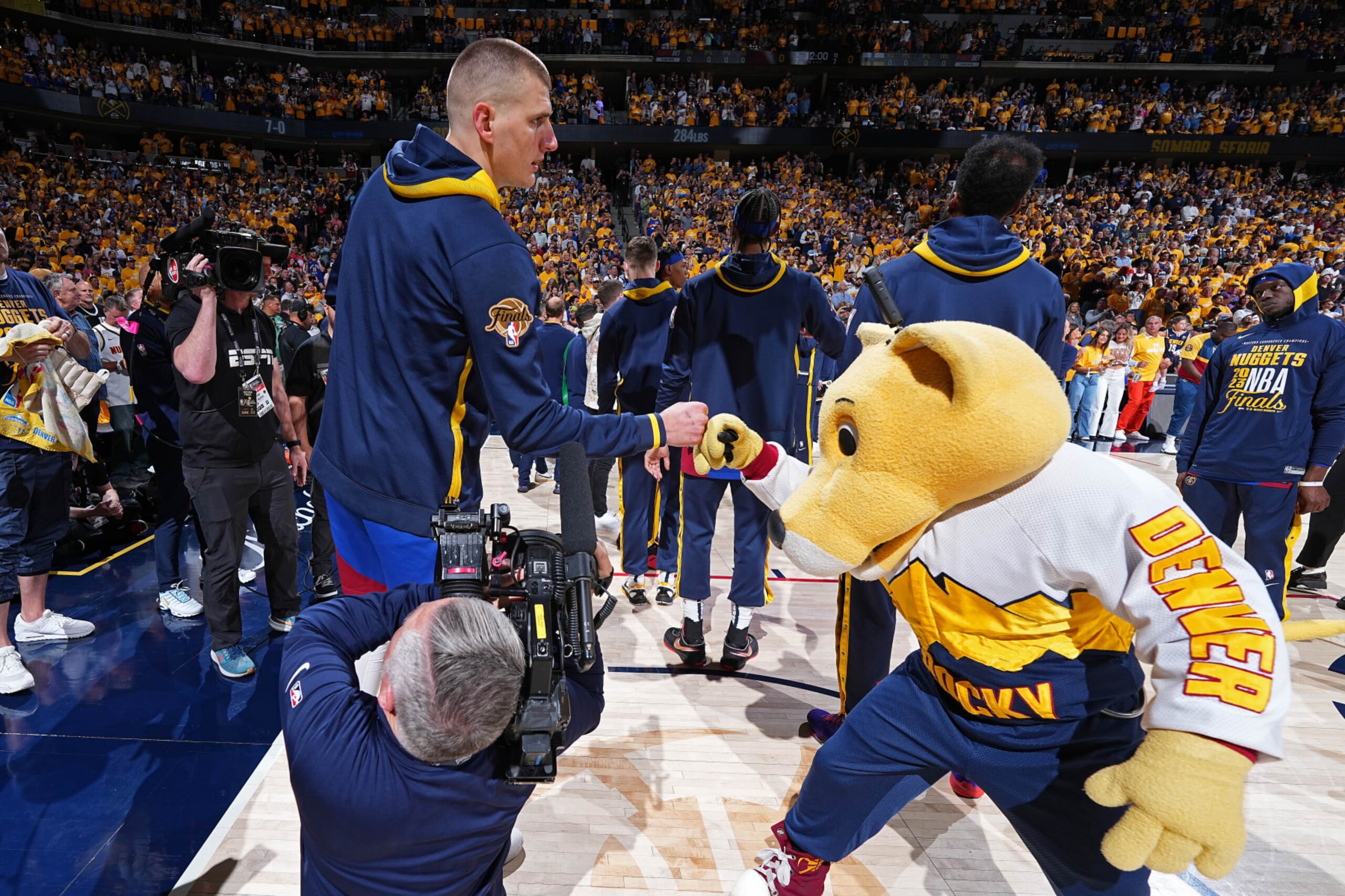 DENVER, CO - JUNE 1: Nikola Jokic #15 of the Denver Nuggets shakes hands with Rocky, the mascot of the Denver Nuggets during Game One of the 2023 NBA Finals against the Miami Heat on June 1, 2023 at the Ball Arena in Denver, Colorado. NOTE TO USER: User expressly acknowledges and agrees that, by downloading and/or using this Photograph, user is consenting to the terms and conditions of the Getty Images License Agreement. Mandatory Copyright Notice: Copyright 2023 NBAE (Photo by Garrett Ellwood/NBAE via Getty Images)
