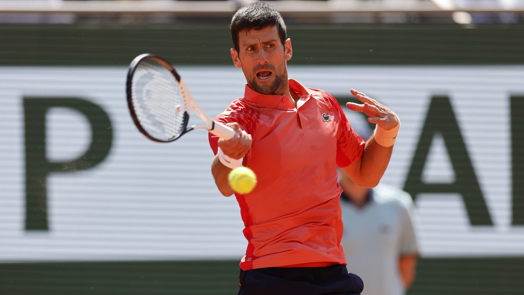 Serbia's Novak Djokovic plays a shot against Aleksandar Kovacevic of the U.S. during their first round match of the French Open tennis tournament at the Roland Garros stadium in Paris, Monday, May 29, 2023. (AP Photo/Jean-Francois Badias)