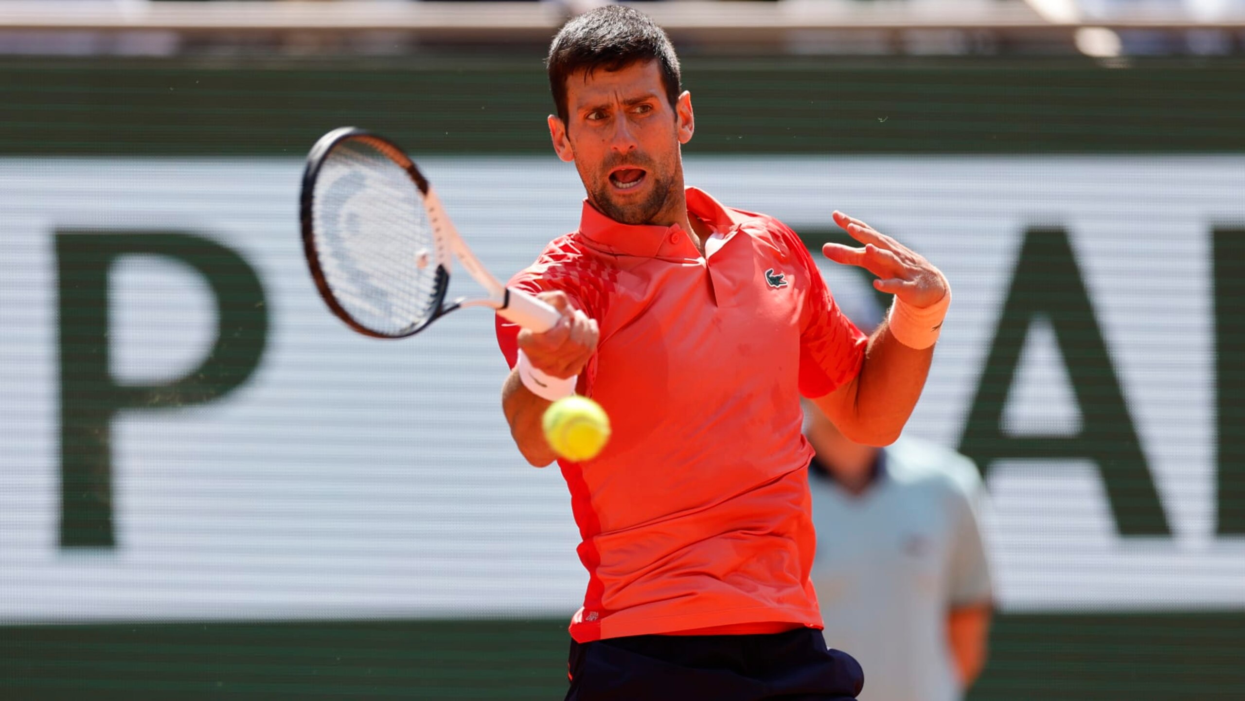 Serbia's Novak Djokovic plays a shot against Aleksandar Kovacevic of the U.S. during their first round match of the French Open tennis tournament at the Roland Garros stadium in Paris, Monday, May 29, 2023. (AP Photo/Jean-Francois Badias)