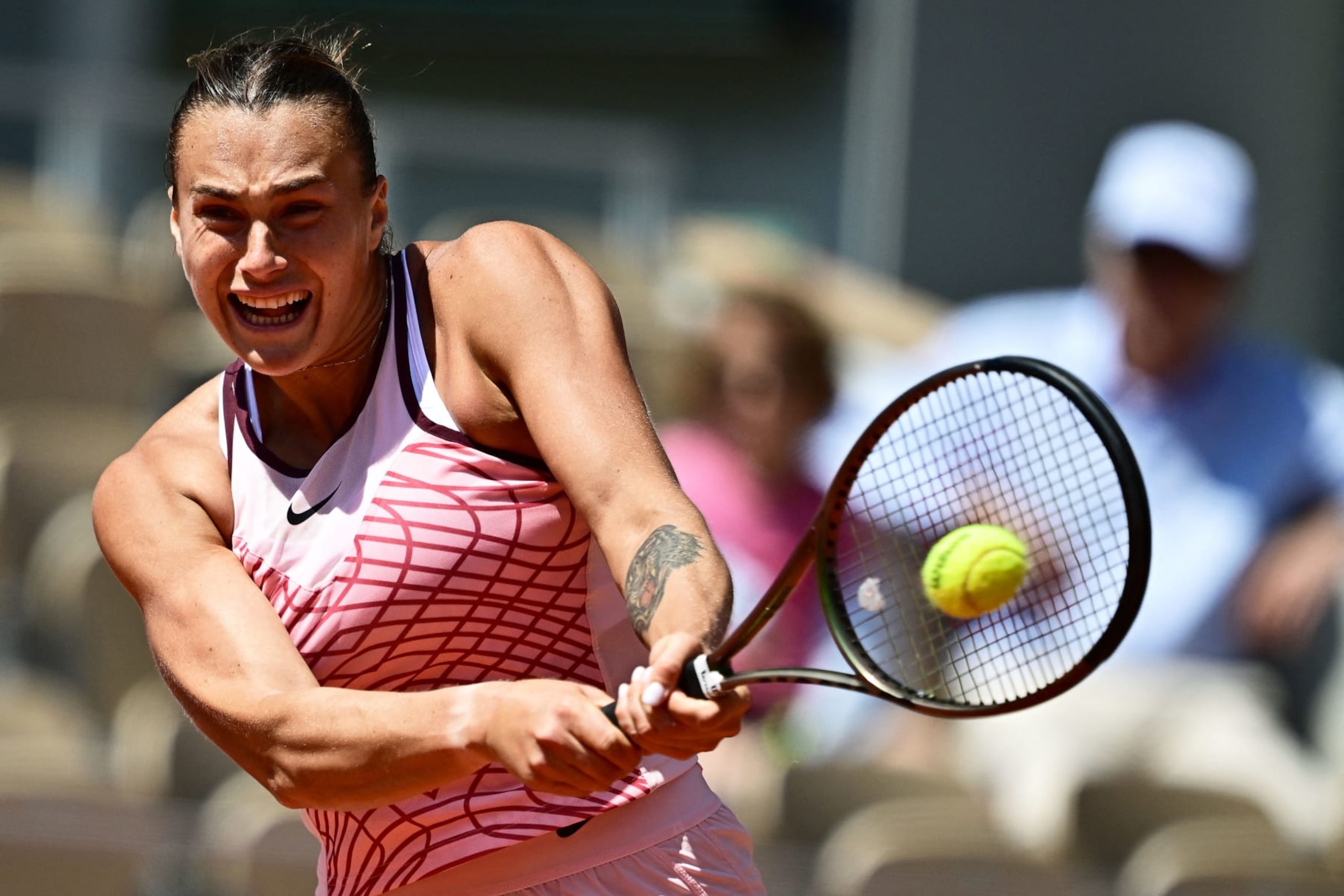 TOPSHOT - Belarus' Aryna Sabalenka plays a backhand return to Russia's Kamilla Rakhimova during their women's singles match on day six of the Roland-Garros Open tennis tournament at the Court Philippe-Chatrier in Paris on June 2, 2023. (Photo by JULIEN DE ROSA / AFP) (Photo by JULIEN DE ROSA/AFP via Getty Images)